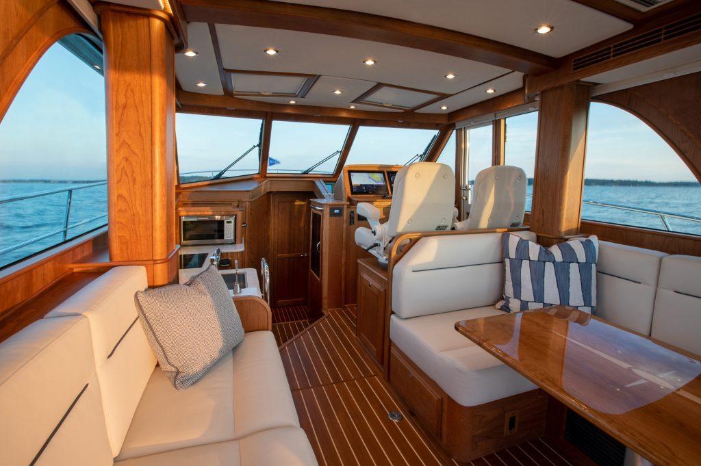 Luxurious interior of 2026 Sabre 43 Salon Express yacht with elegant wood finishes.
