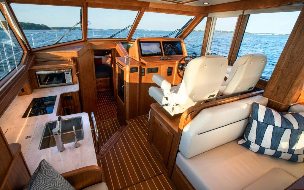 Interior of 2026 Sabre 43 Salon Express yacht with luxurious seating and modern kitchen.