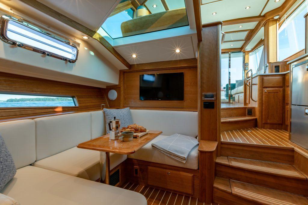 Luxurious interior of 2026 Sabre 43 Salon Express yacht with elegant wood finishes.