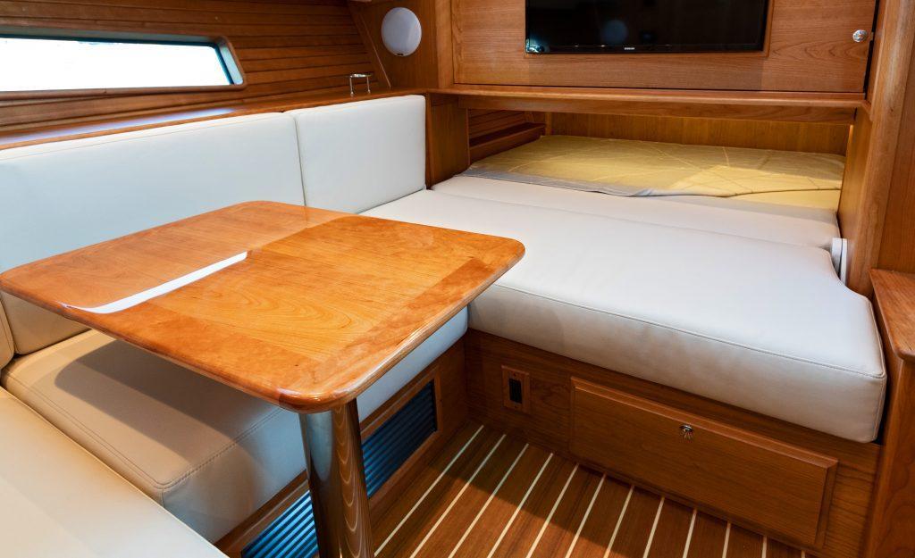 Interior of 2026 Sabre 43 Salon Express, featuring a cozy dining and sleeping area.