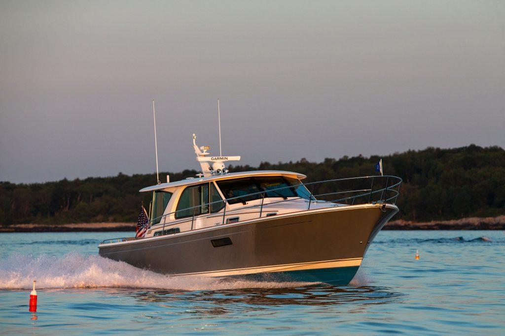2026 Sabre 43 Salon Express cruising on calm waters at sunset.