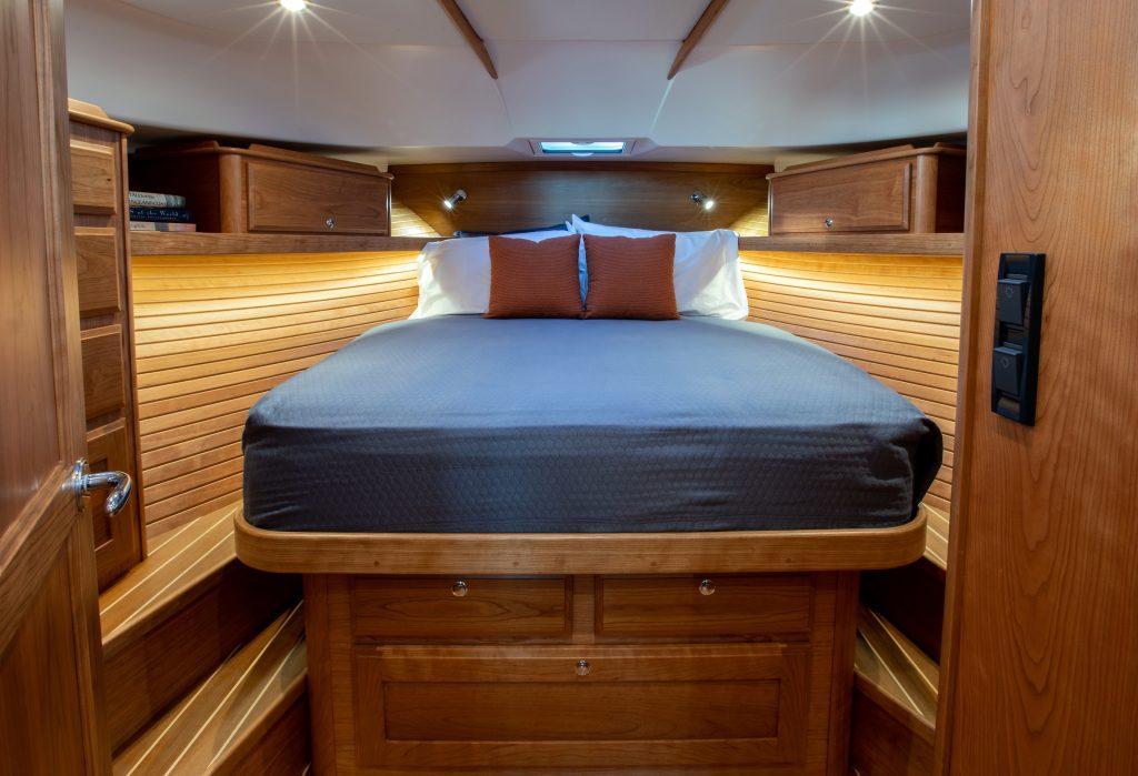 Luxurious cabin interior of 2026 Sabre 43 Salon Express yacht with wooden finish.