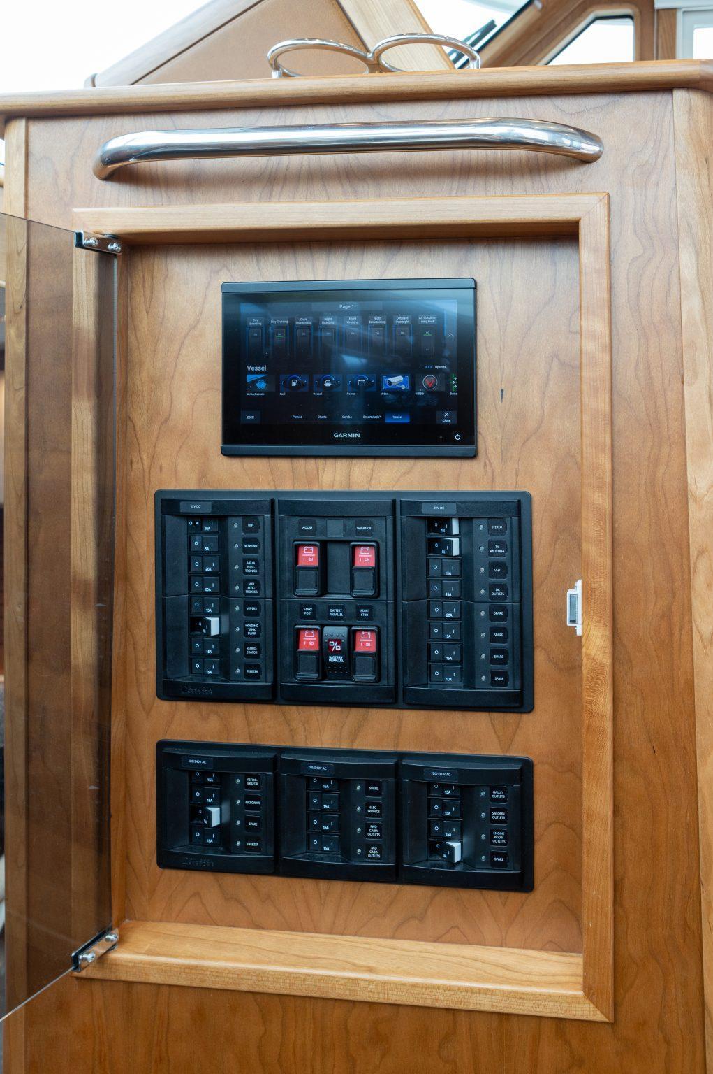 Electrical control panel on 2026 Sabre 43 Salon Express yacht, featuring touchscreen and switches.
