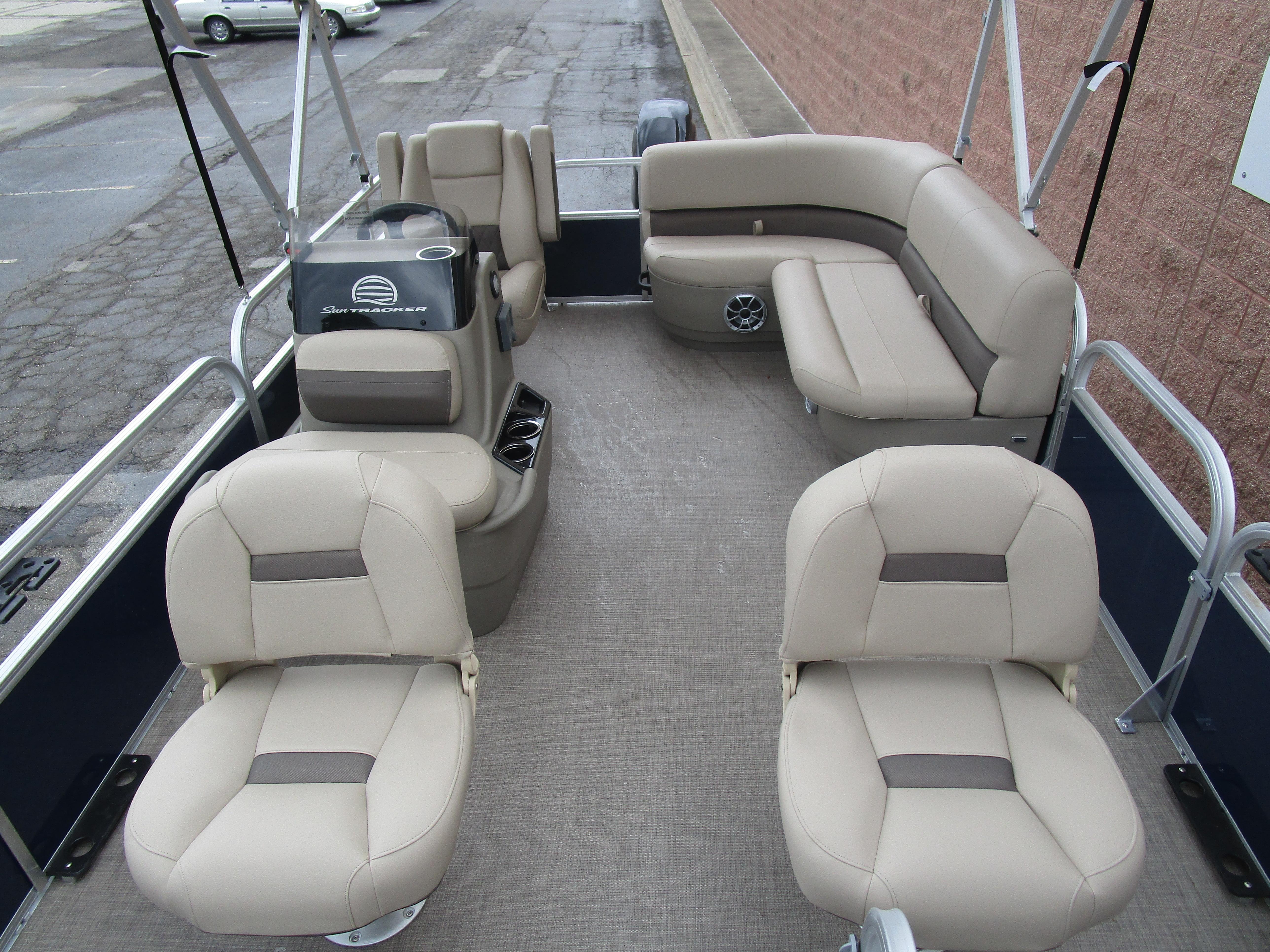 2025 Sun Tracker Bass Buggy 16 pontoon boat interior with beige seating and spacious layout.
