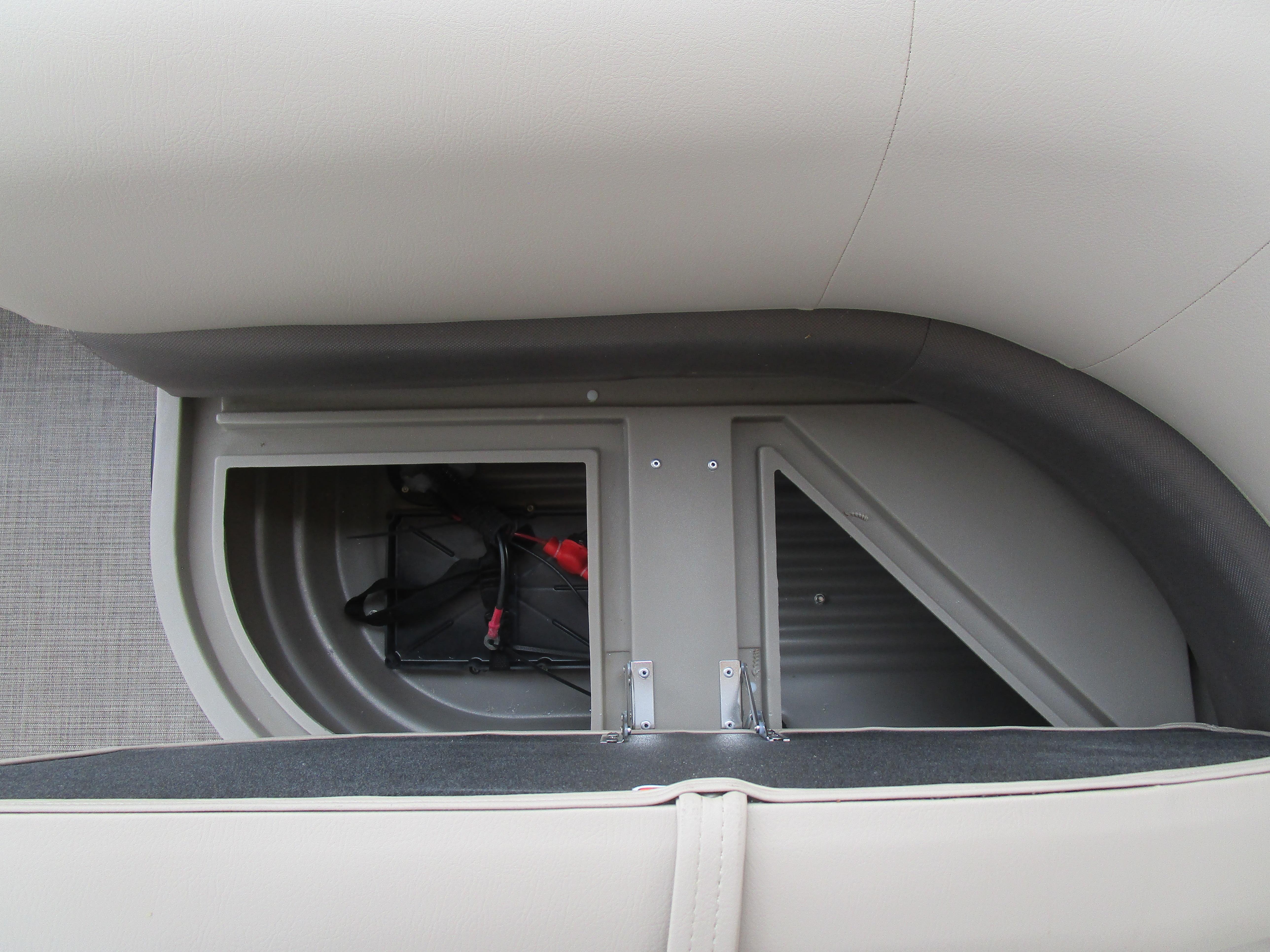 2025 Sun Tracker Bass Buggy 16 storage compartment with open hatch.