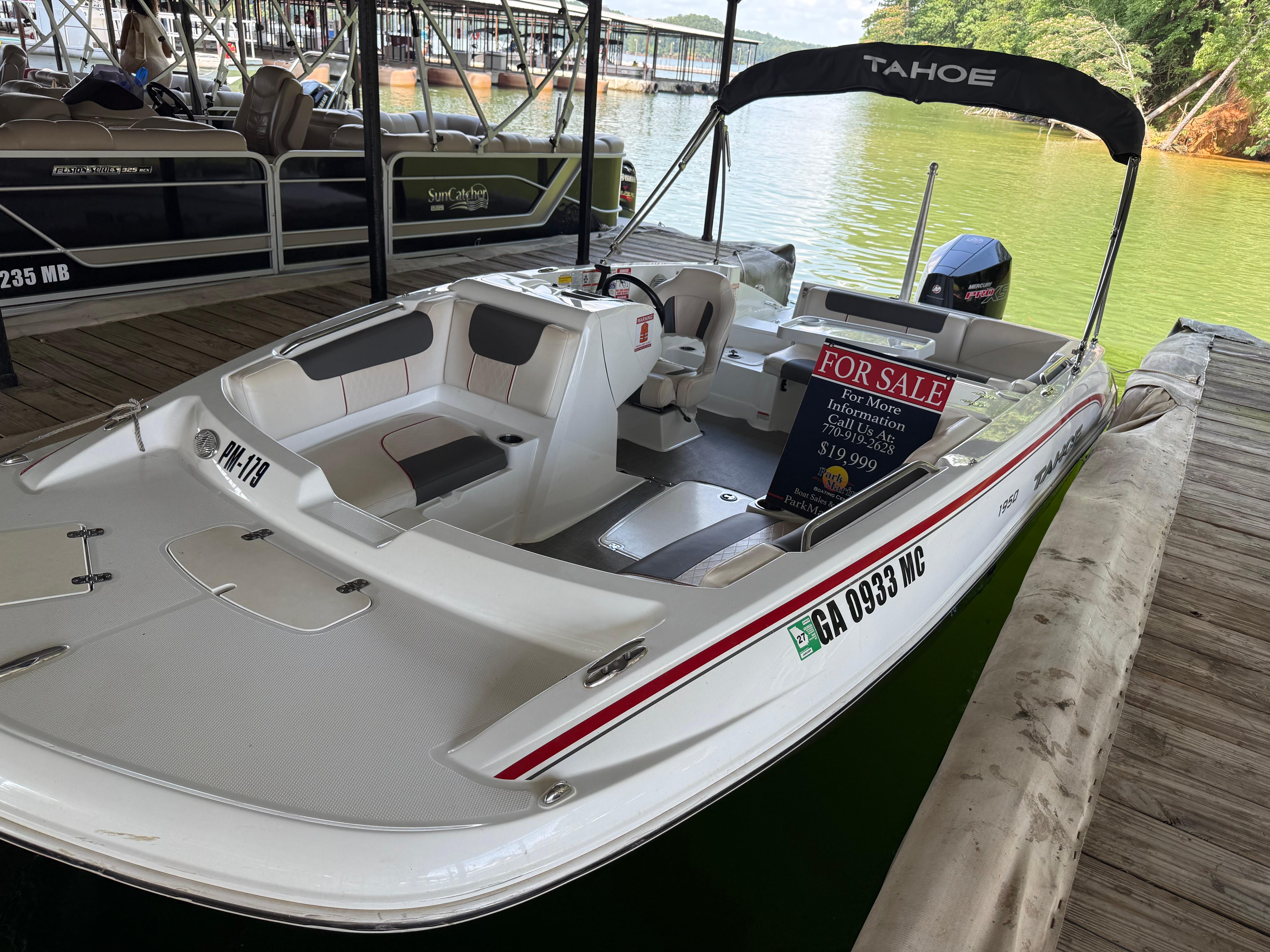 Boat for sale at dock, Tahoe 1950 model, 2021, priced at $19,999.