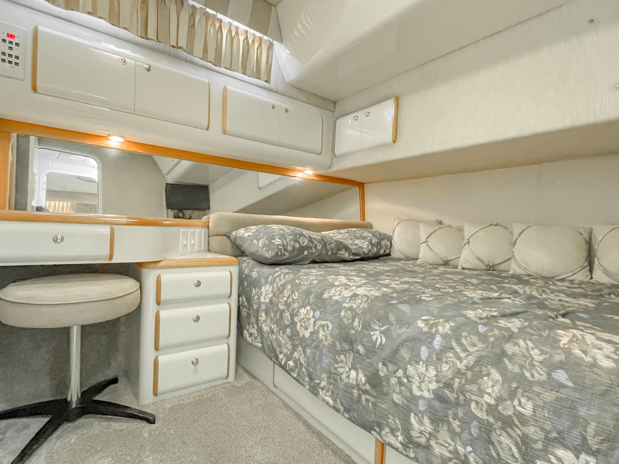 VIP Stateroom -Queen Bed with Storage Beneath and Vanity w/Seat