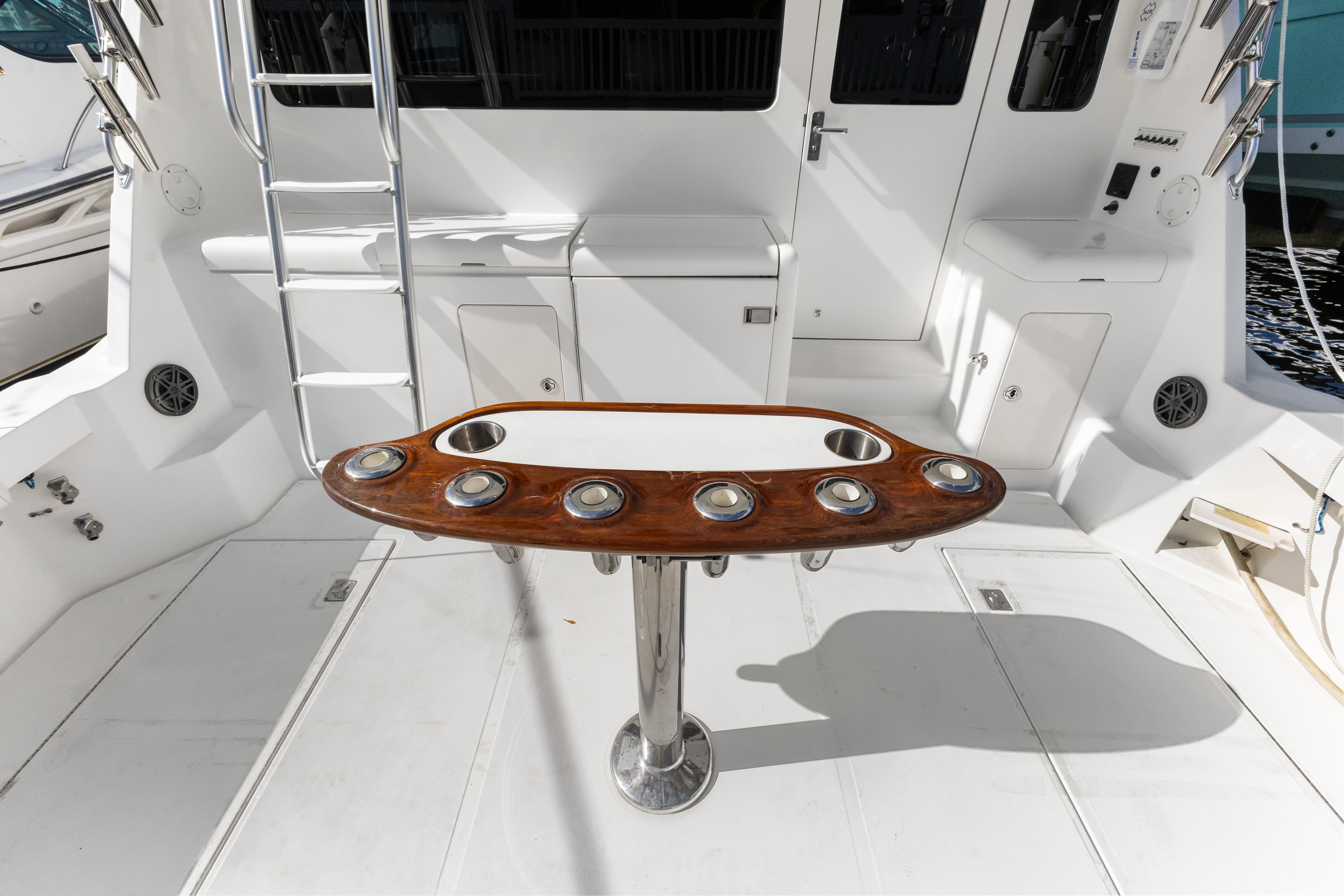Cabo-40 Flybridge 2011-WELL PLAYED FL-US-2011 Cabo 40 Flybridge yacht cockpit with rod holders and ladder.-9659613 | Thumbnail