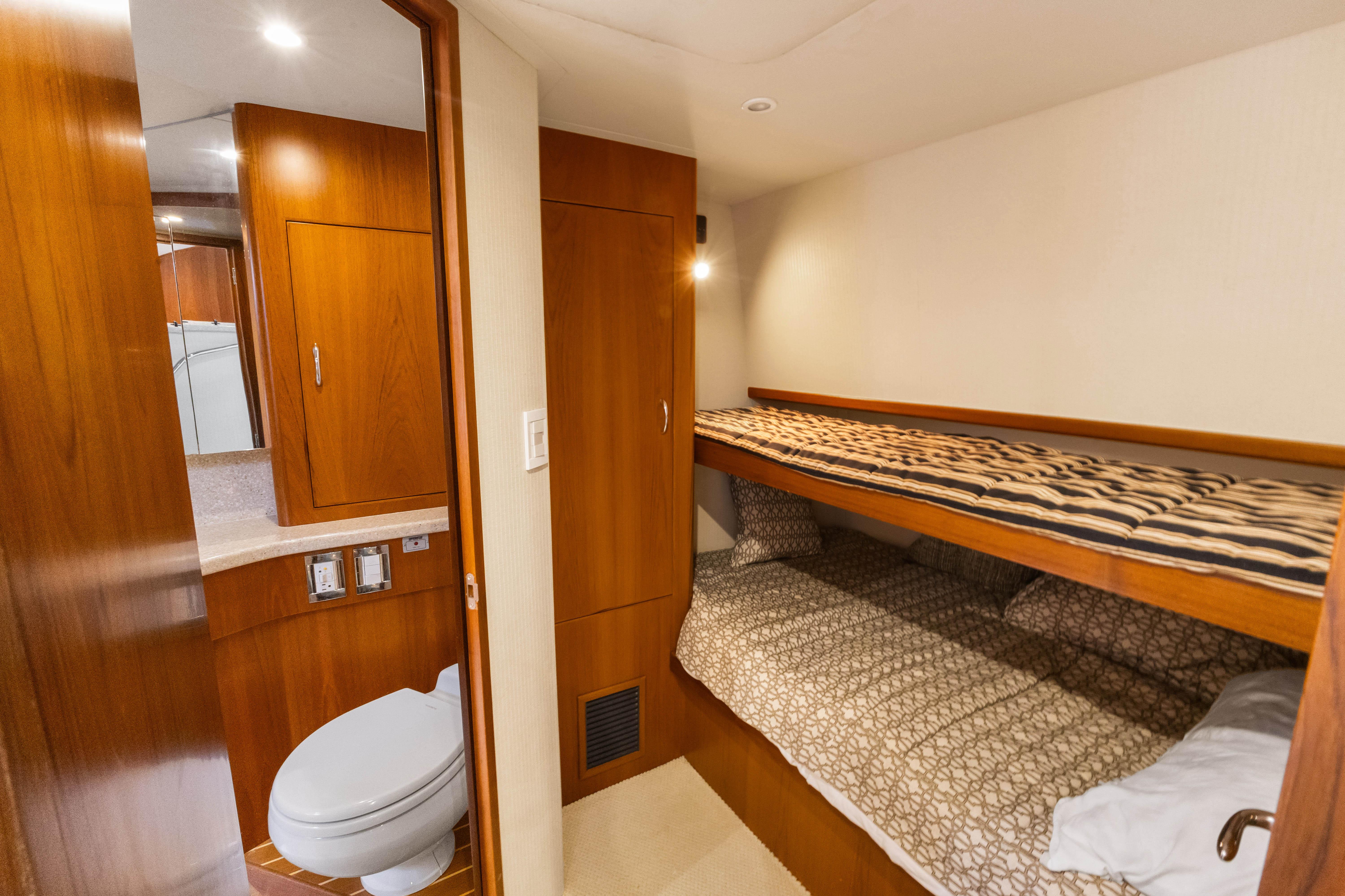 Cabo-40 Flybridge 2011-WELL PLAYED FL-US-Interior of 2011 Cabo 40 Flybridge yacht with bunk beds and wooden cabinetry.-9659613 | Thumbnail