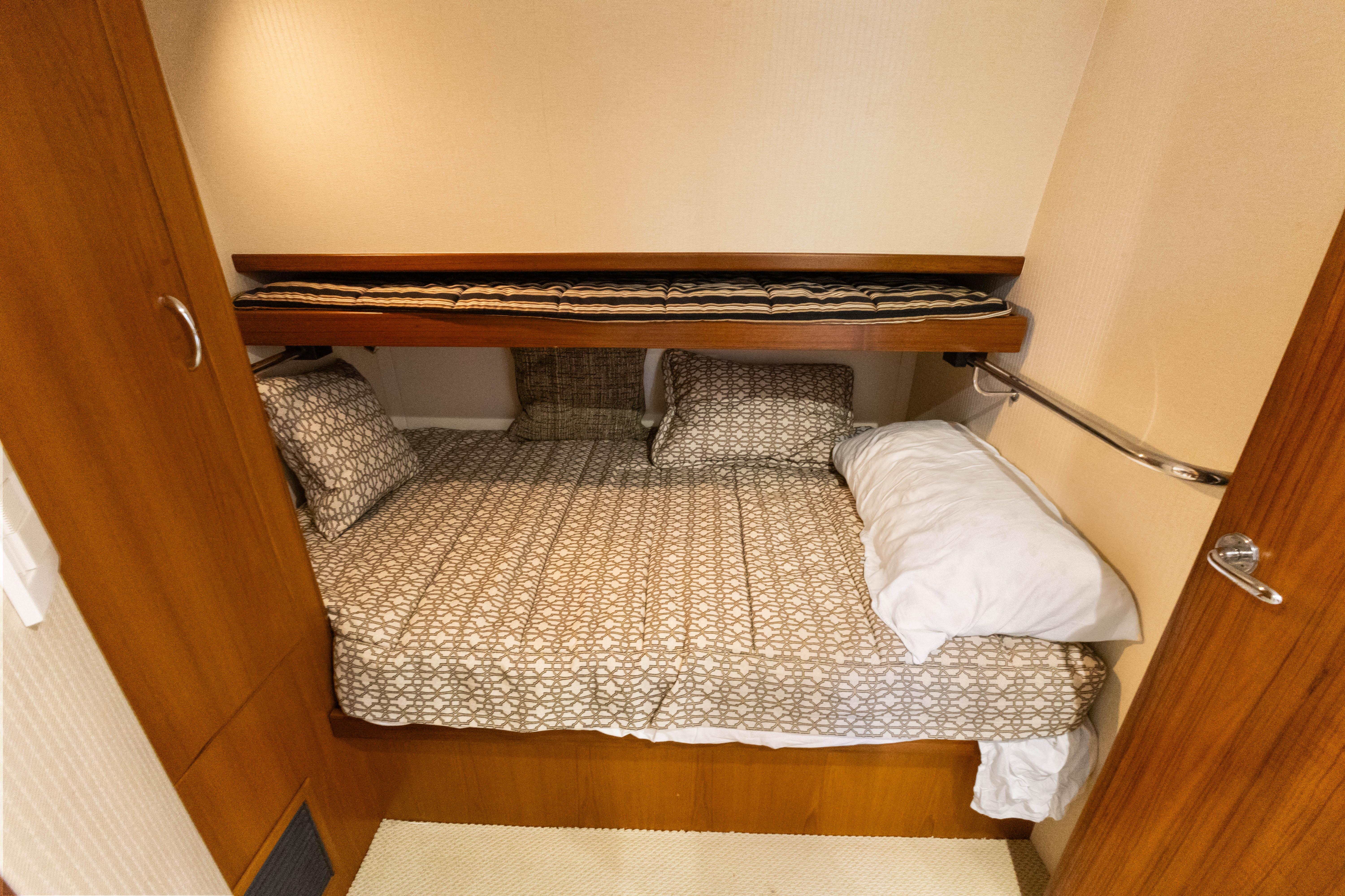 Cabo-40 Flybridge 2011-WELL PLAYED FL-US-Cozy cabin bedroom in 2011 Cabo 40 Flybridge yacht with patterned bedding.-9659613 | Thumbnail