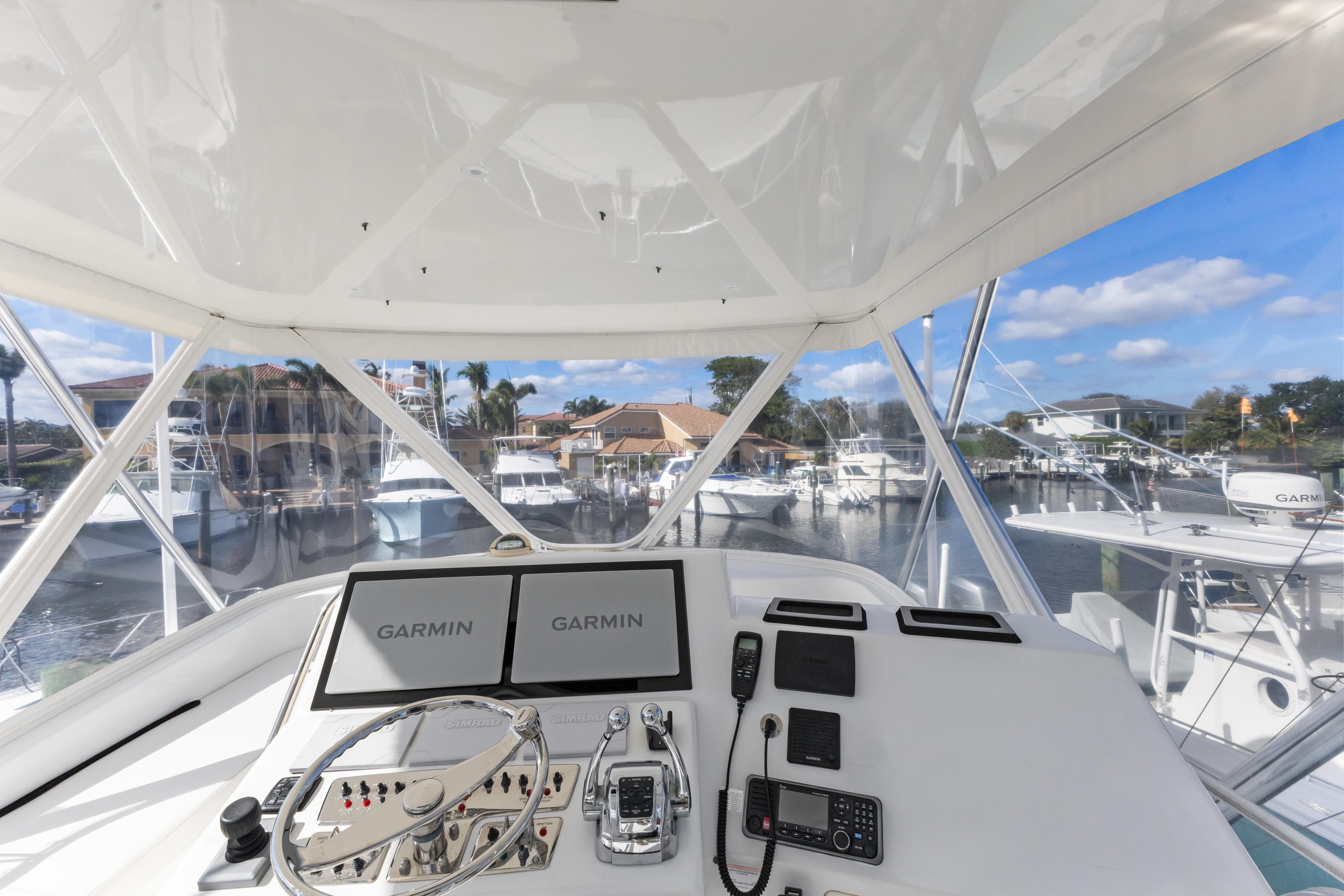 Cabo-40 Flybridge 2011-WELL PLAYED FL-US-Cabo 40 Flybridge 2011 helm with Garmin displays, marina view.-9659613 | Thumbnail