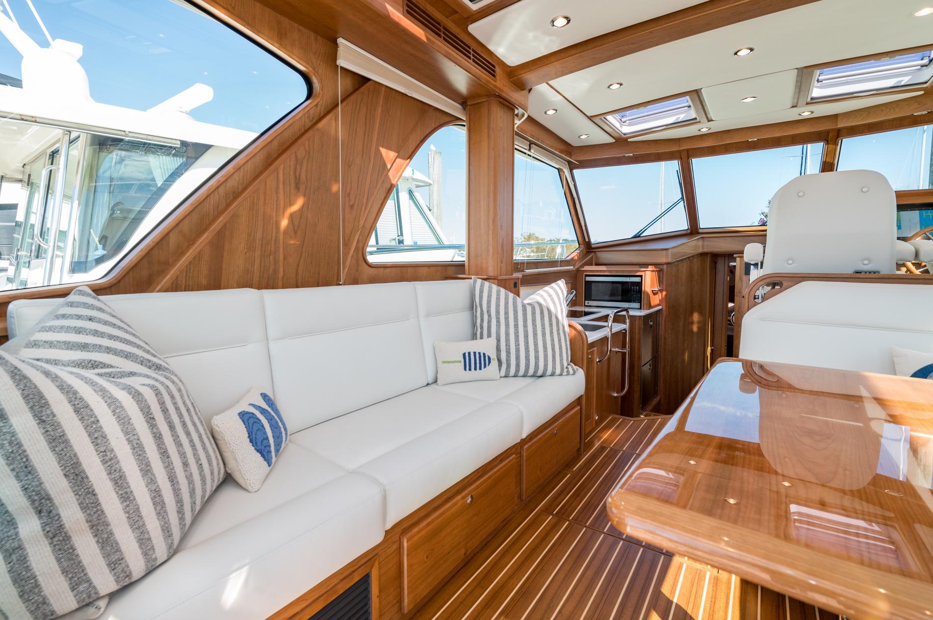 Luxurious interior of 2025 Sabre 43 Salon Express yacht with elegant wood finish.