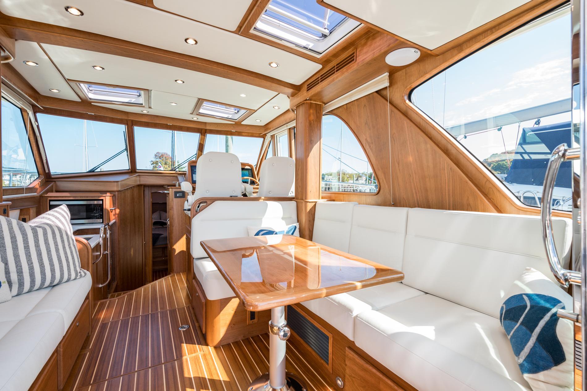 Luxurious interior of 2025 Sabre 43 Salon Express yacht with elegant wood finish.