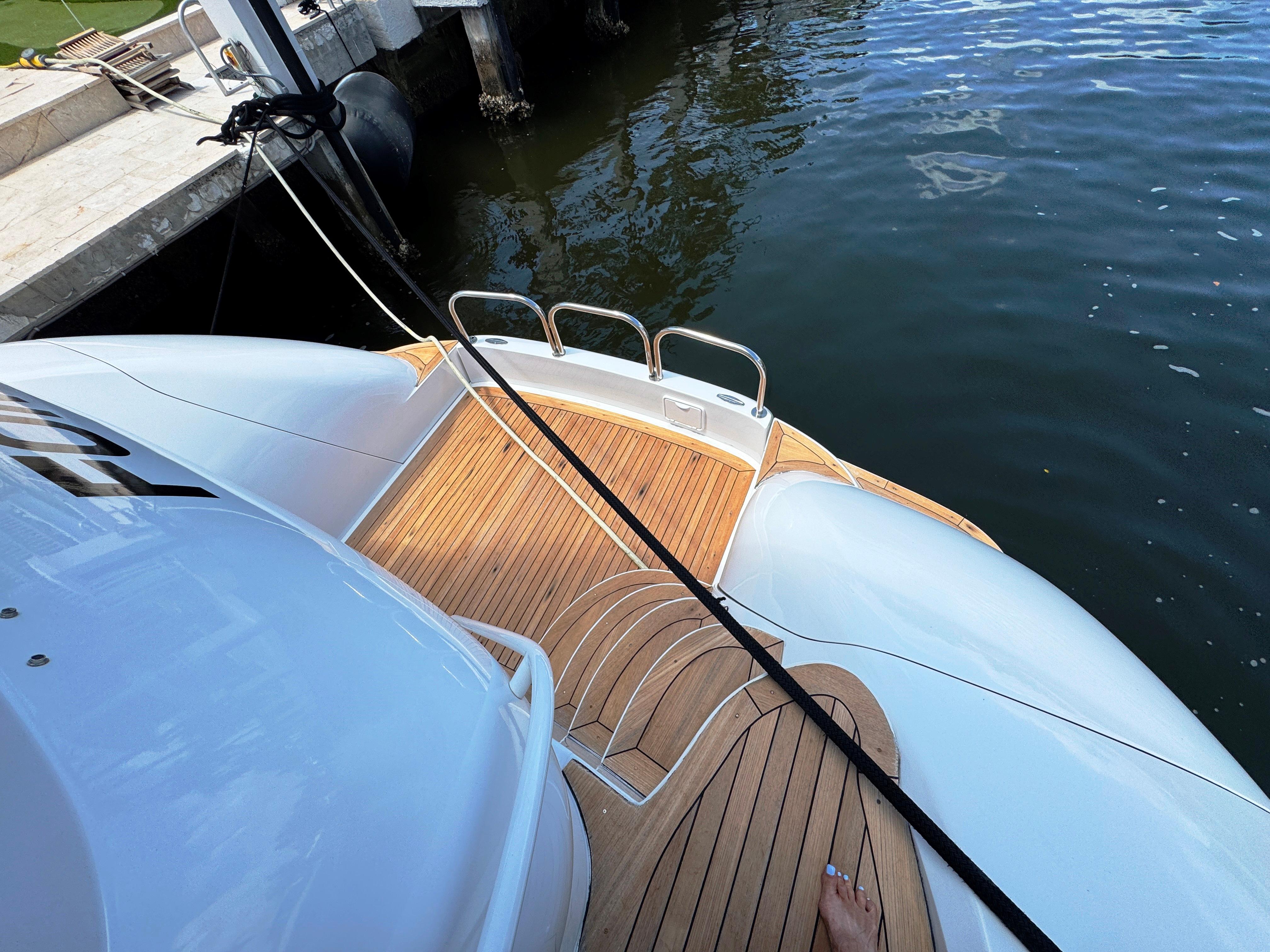 Lazzara-80 Skylounge 2002-Fomo2 FL-US-Lazzara 80 Skylounge 2002 yacht with teak deck, docked by the water.-9749638 | Thumbnail