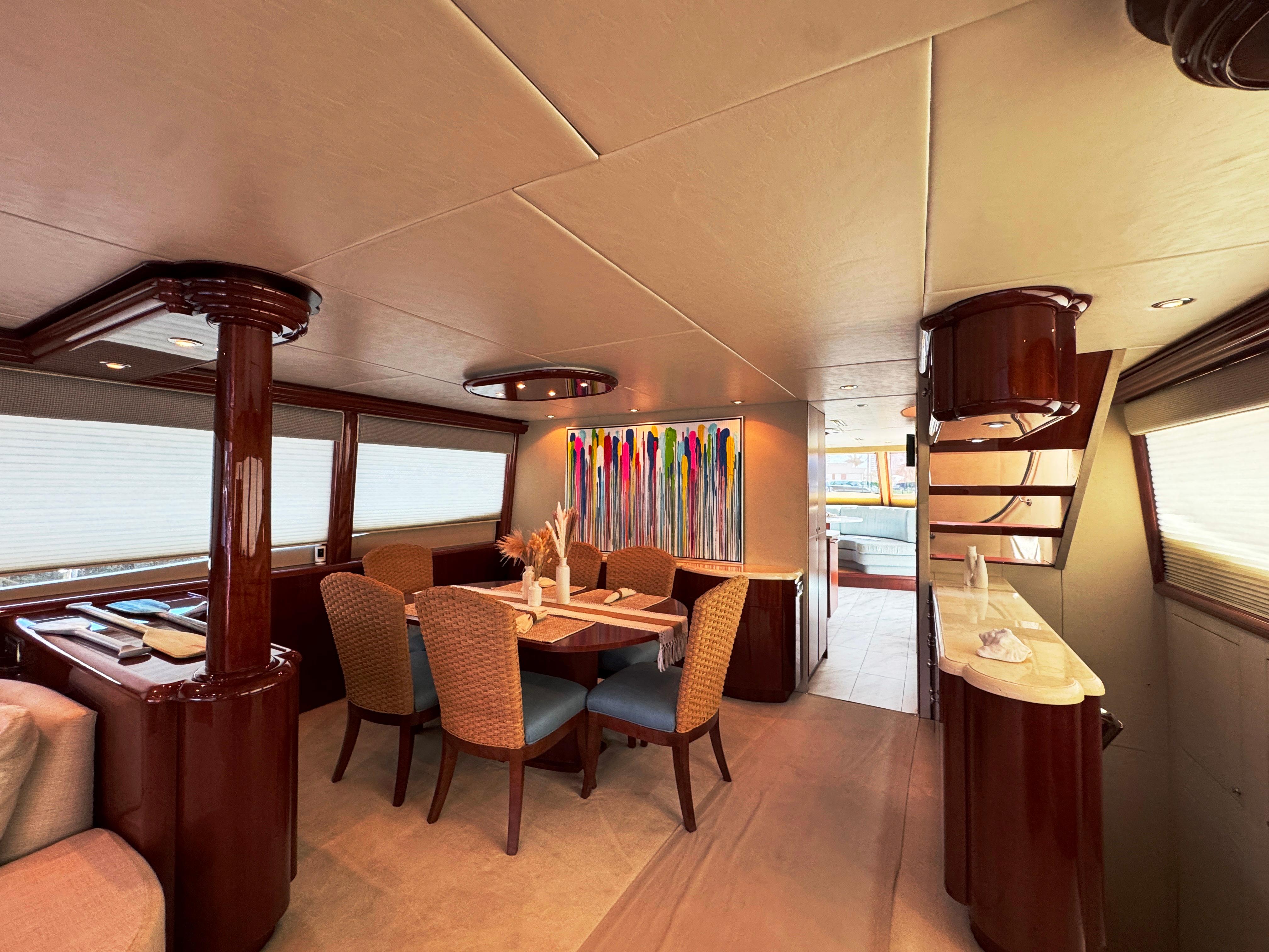 Lazzara-80 Skylounge 2002-Fomo2 FL-US-Luxurious interior of 2002 Lazzara 80 Skylounge yacht with elegant dining area and modern decor.-9749638 | Thumbnail