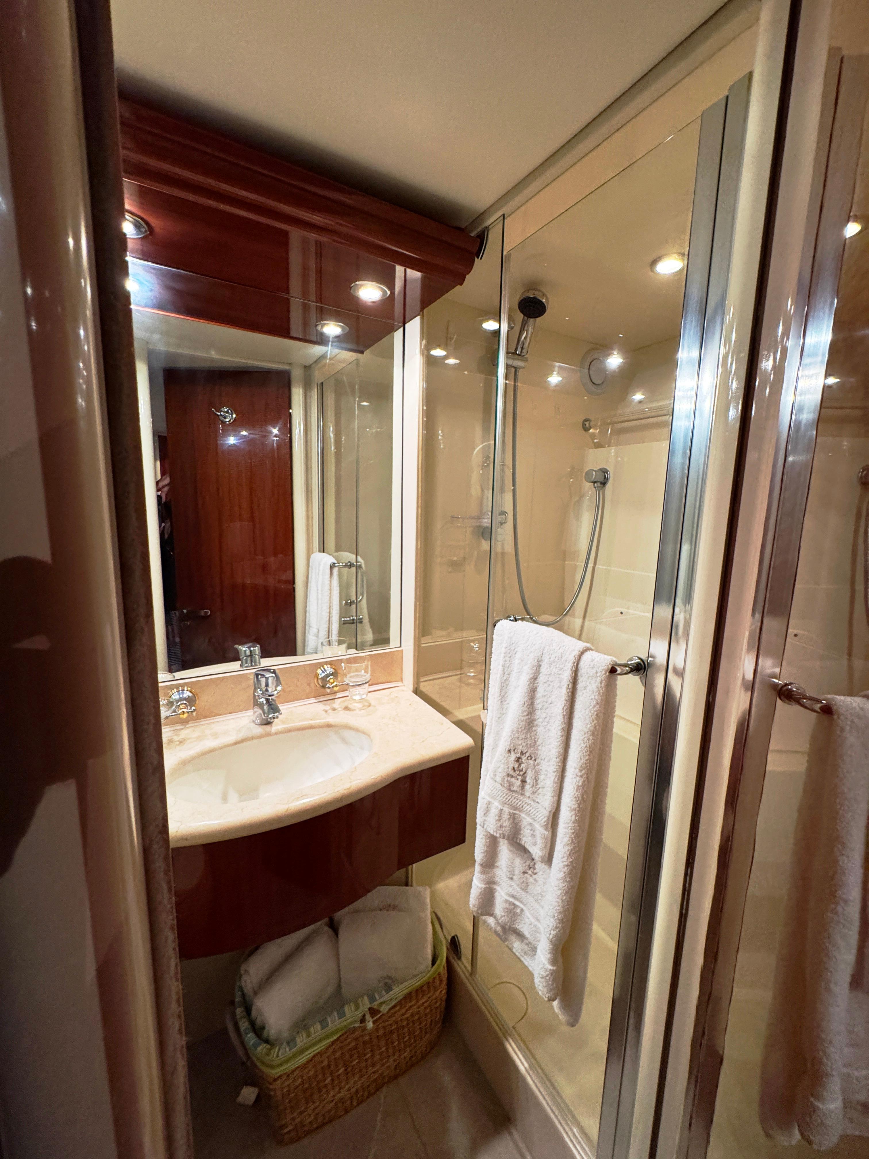 Lazzara-80 Skylounge 2002-Fomo2 FL-US-Luxurious bathroom in 2002 Lazzara 80 Skylounge yacht with modern fixtures and glass shower.-9749638 | Thumbnail