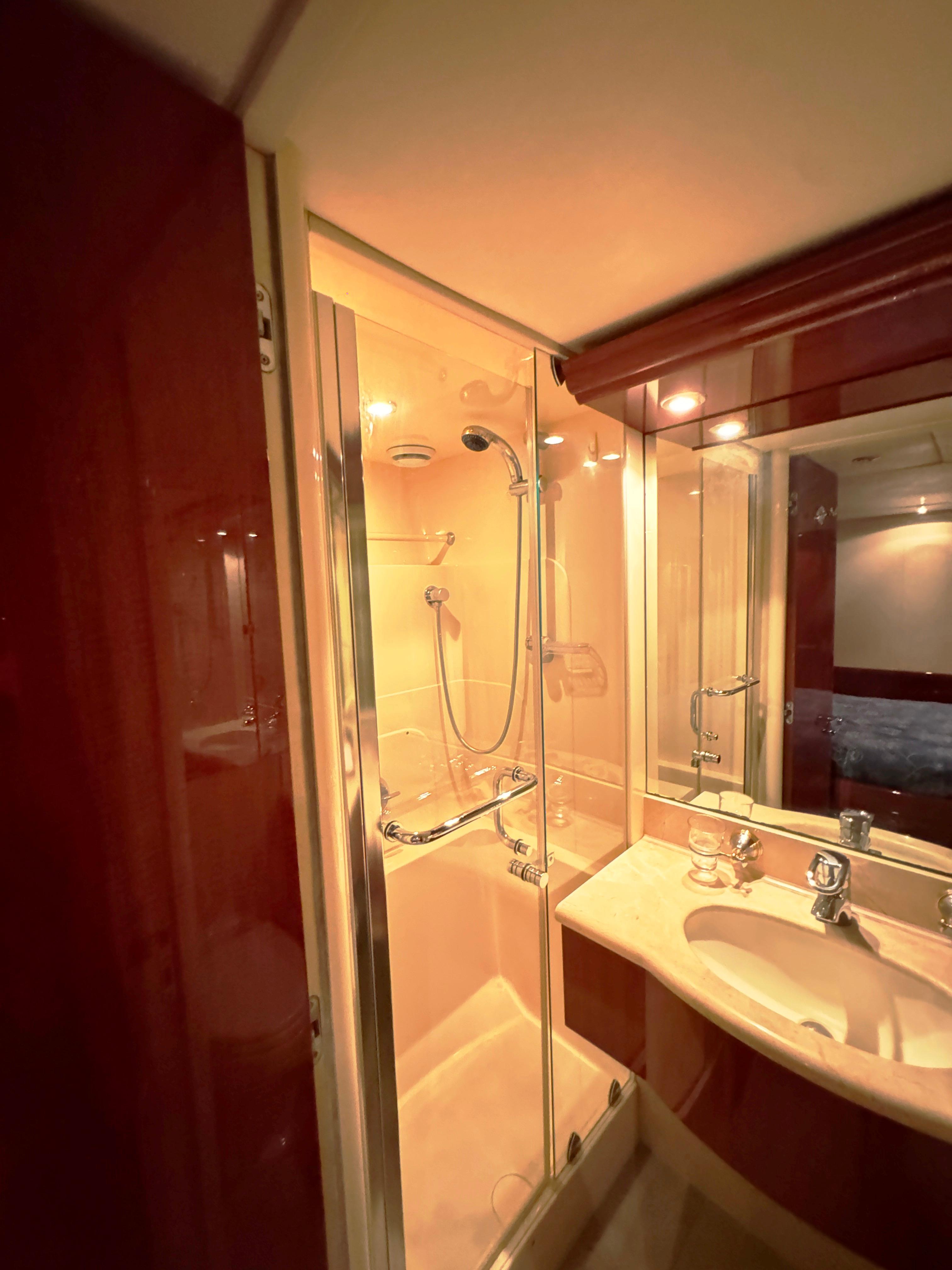 Lazzara-80 Skylounge 2002-Fomo2 FL-US-Luxurious bathroom in 2002 Lazzara 80 Skylounge yacht with shower and vanity.-9749638 | Thumbnail