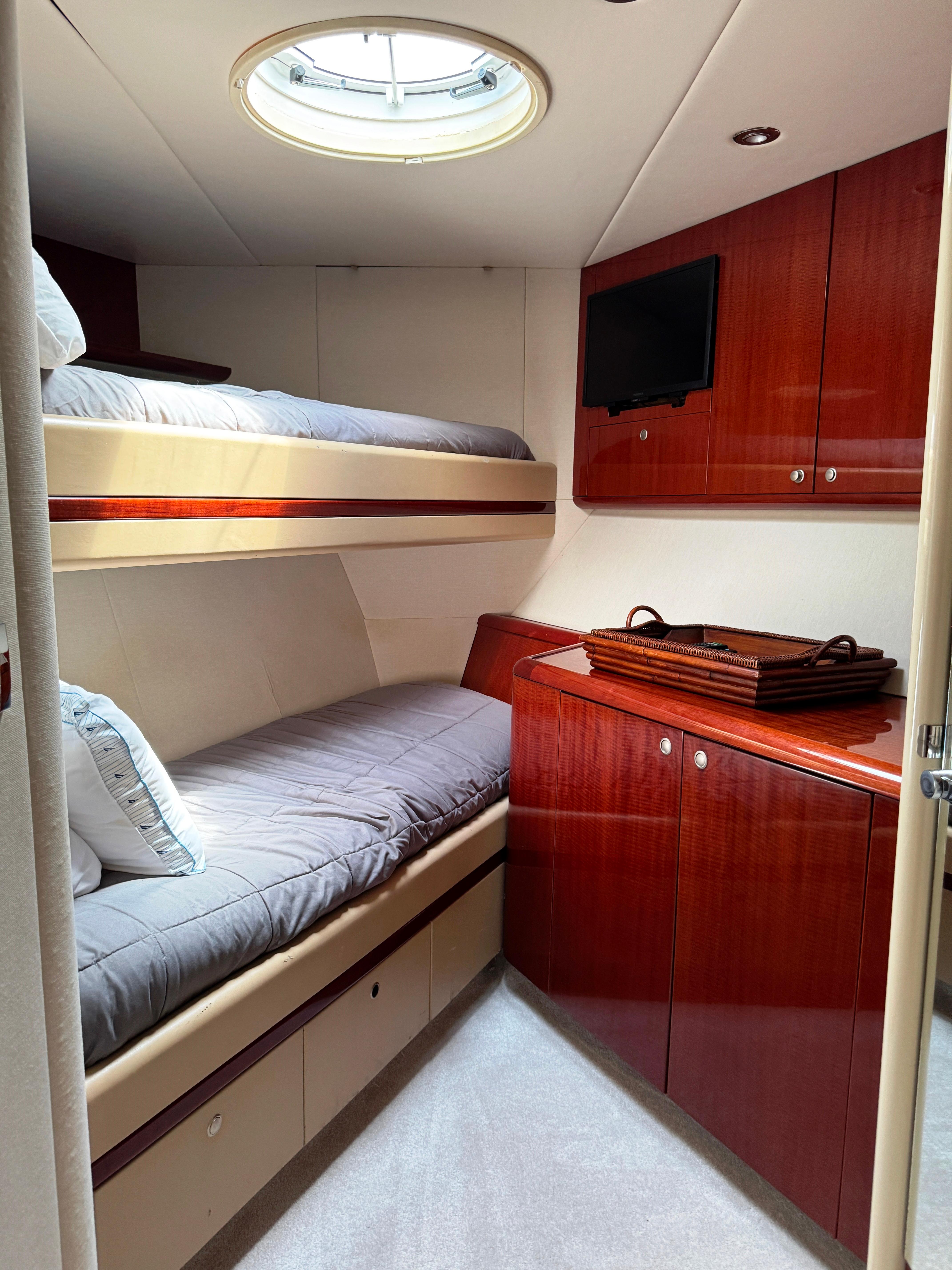 Lazzara-80 Skylounge 2002-Fomo2 FL-US-Luxurious 2002 Lazzara 80 Skylounge yacht cabin with bunk beds and elegant wood cabinetry.-9749638 | Thumbnail