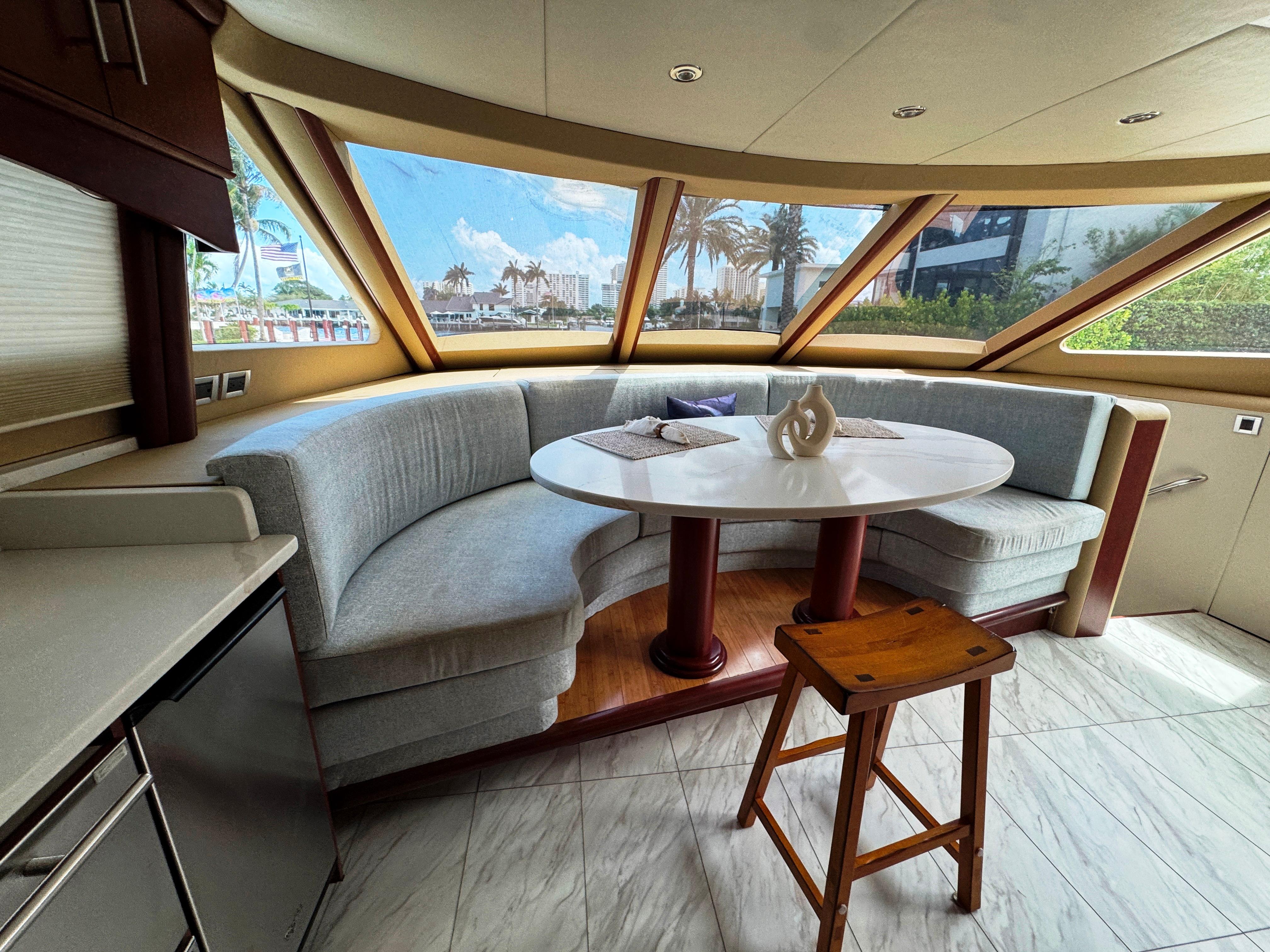 Lazzara-80 Skylounge 2002-Fomo2 FL-US-Luxurious 2002 Lazzara 80 Skylounge yacht interior with curved seating and panoramic windows.-9749638 | Thumbnail