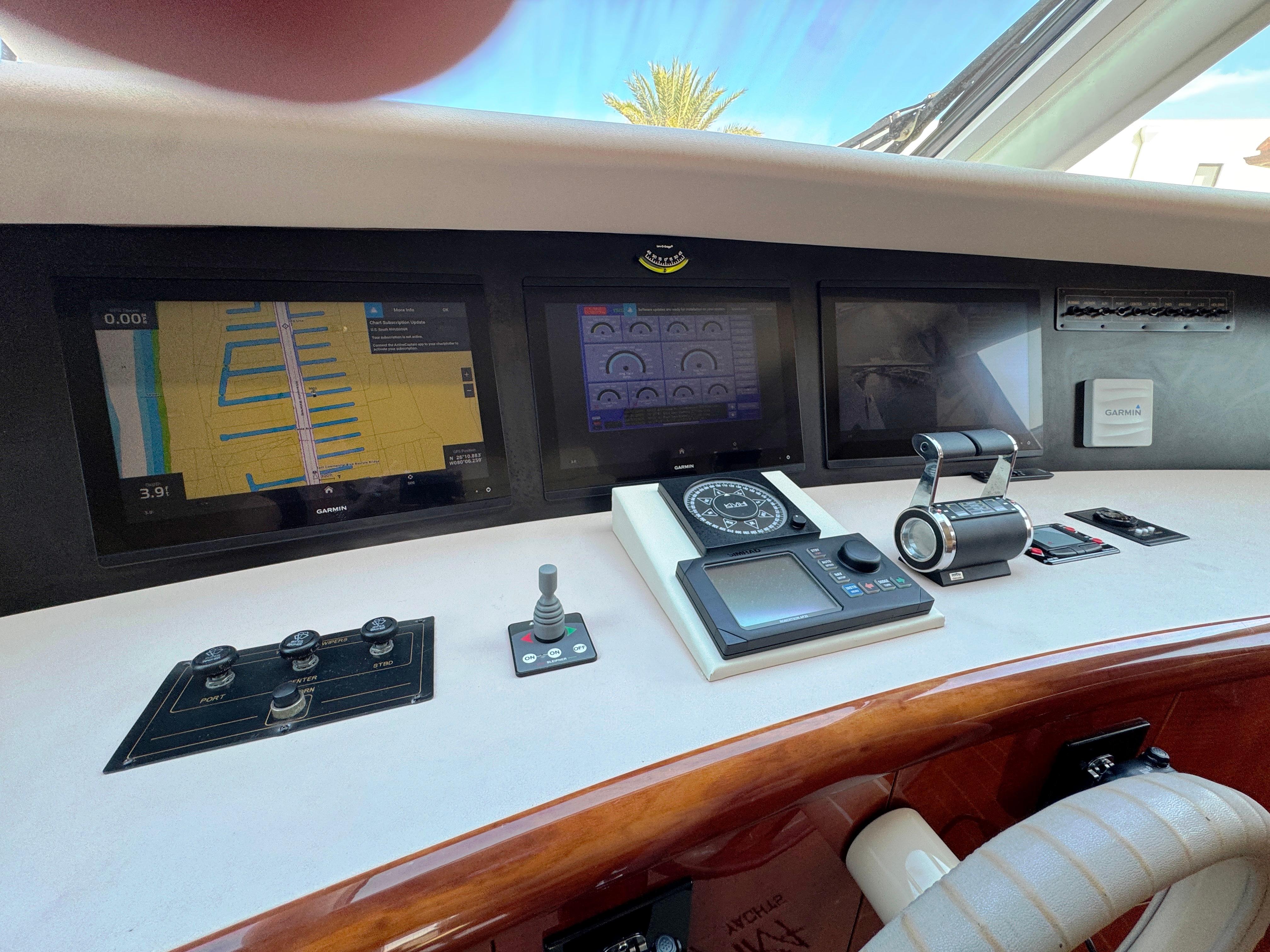 Lazzara-80 Skylounge 2002-Fomo2 FL-US-Control panel of a 2002 Lazzara 80 Skylounge yacht with navigation screens.-9749638 | Thumbnail
