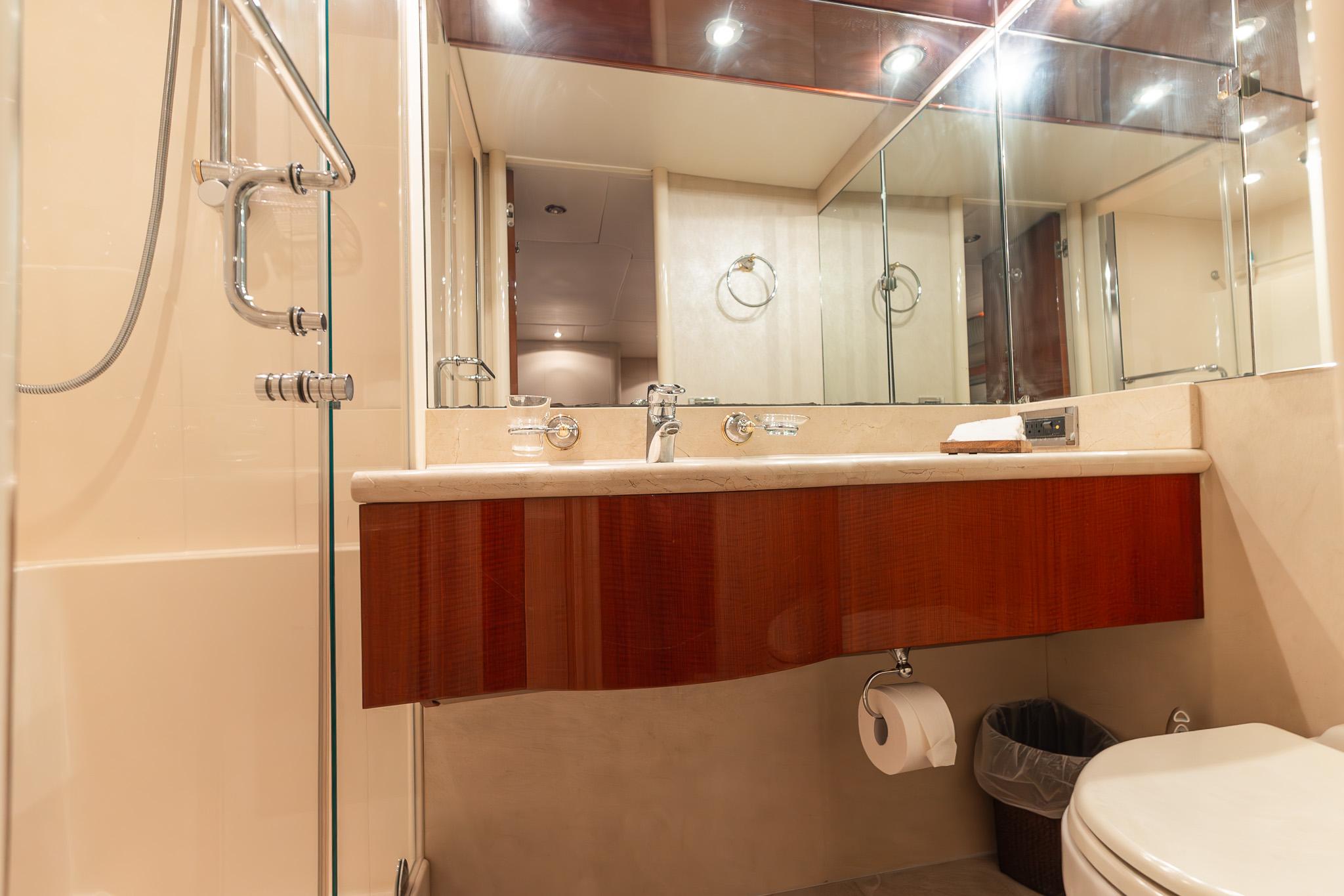 Lazzara-80 Skylounge 2002-Fomo2 FL-US-Luxurious bathroom in 2002 Lazzara 80 Skylounge yacht with modern fixtures and elegant design.-9749638 | Thumbnail
