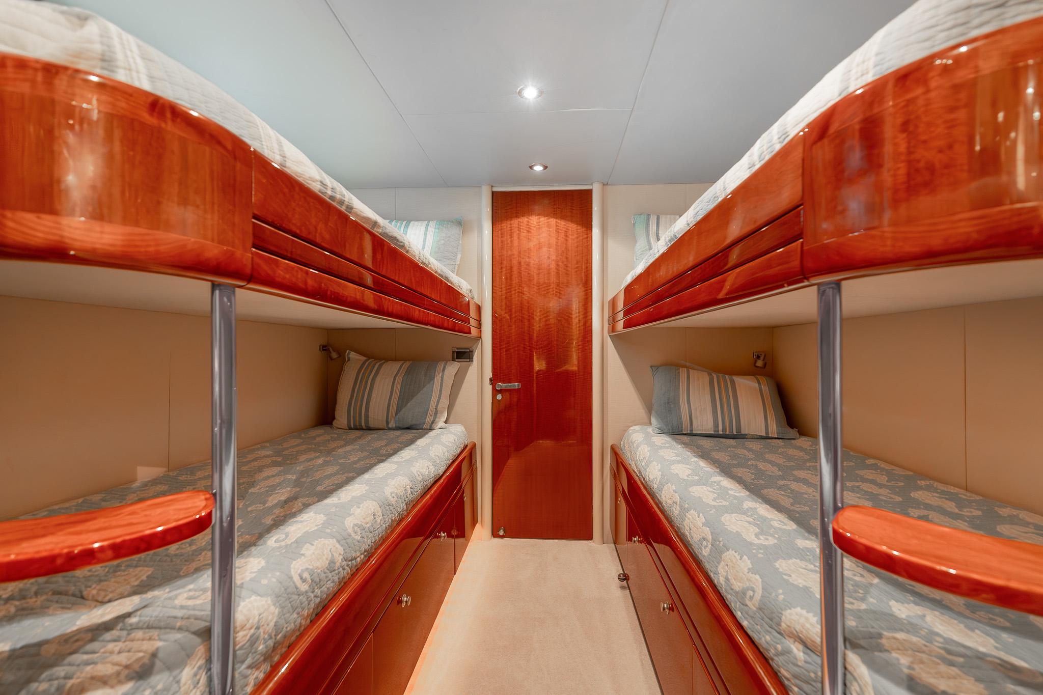 Lazzara-80 Skylounge 2002-Fomo2 FL-US-Luxurious 2002 Lazzara 80 Skylounge yacht cabin with elegant wooden bunk beds.-9749638 | Thumbnail