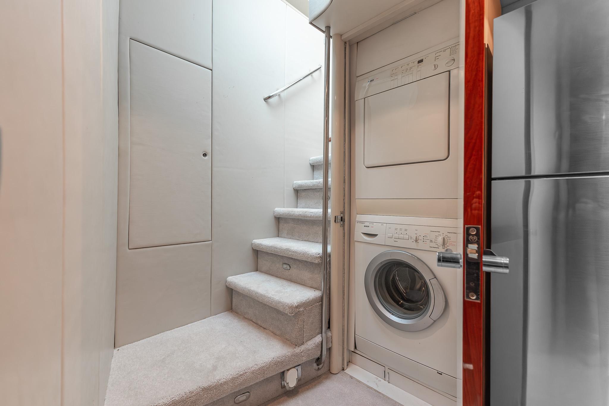 Lazzara-80 Skylounge 2002-Fomo2 FL-US-Laundry area with washer and dryer in 2002 Lazzara 80 Skylounge yacht.-9749638 | Thumbnail