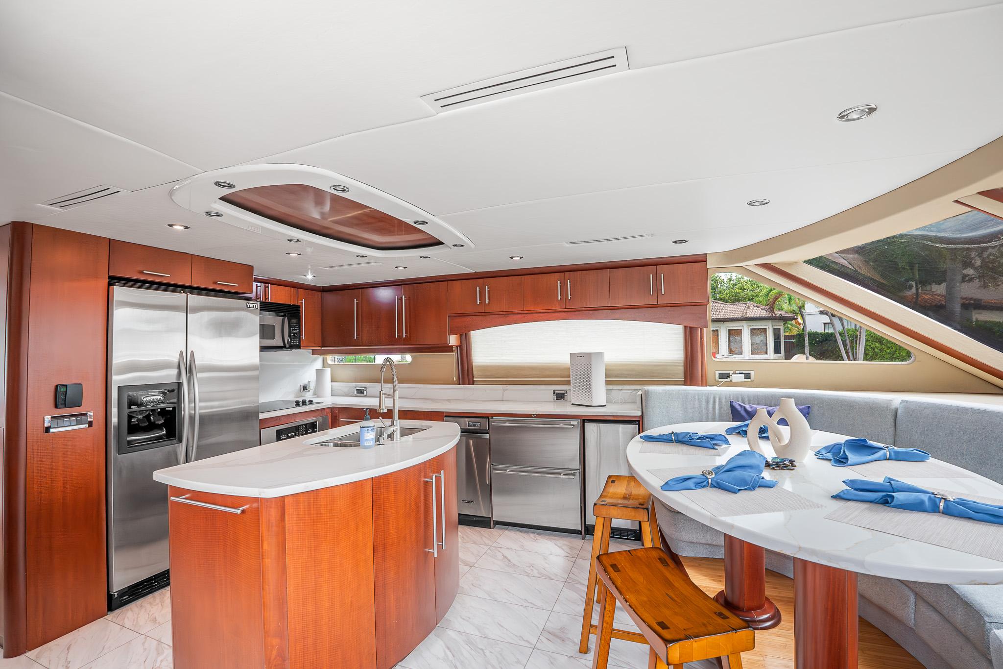 Lazzara-80 Skylounge 2002-Fomo2 FL-US-Luxurious kitchen and dining area in a 2002 Lazzara 80 Skylounge yacht, featuring modern appliances.-9749638 | Thumbnail