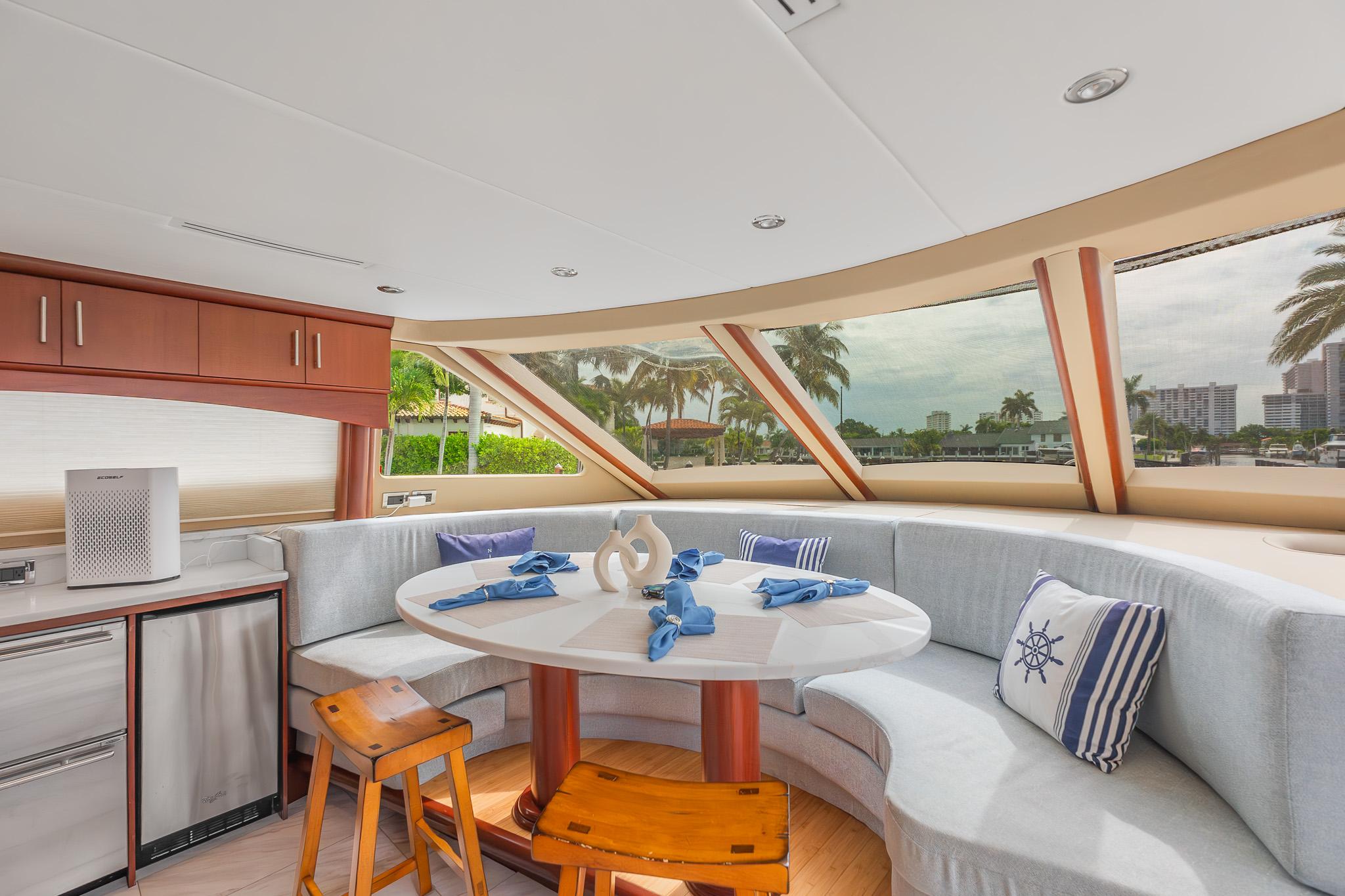 Lazzara-80 Skylounge 2002-Fomo2 FL-US-Luxurious interior of 2002 Lazzara 80 Skylounge yacht with panoramic windows and elegant dining area.-9749638 | Thumbnail
