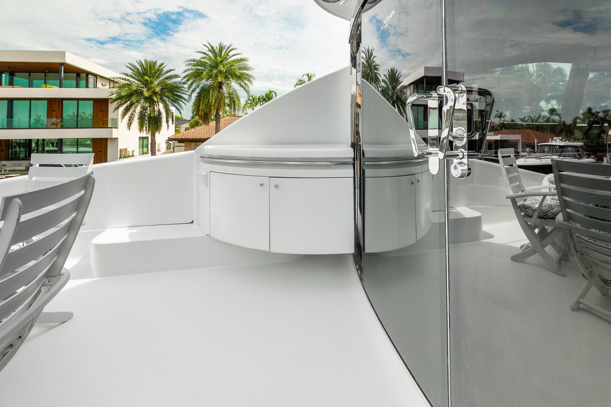 Lazzara-80 Skylounge 2002-Fomo2 FL-US-Luxurious 2002 Lazzara 80 Skylounge yacht deck with modern seating and sleek design.-9749638 | Thumbnail