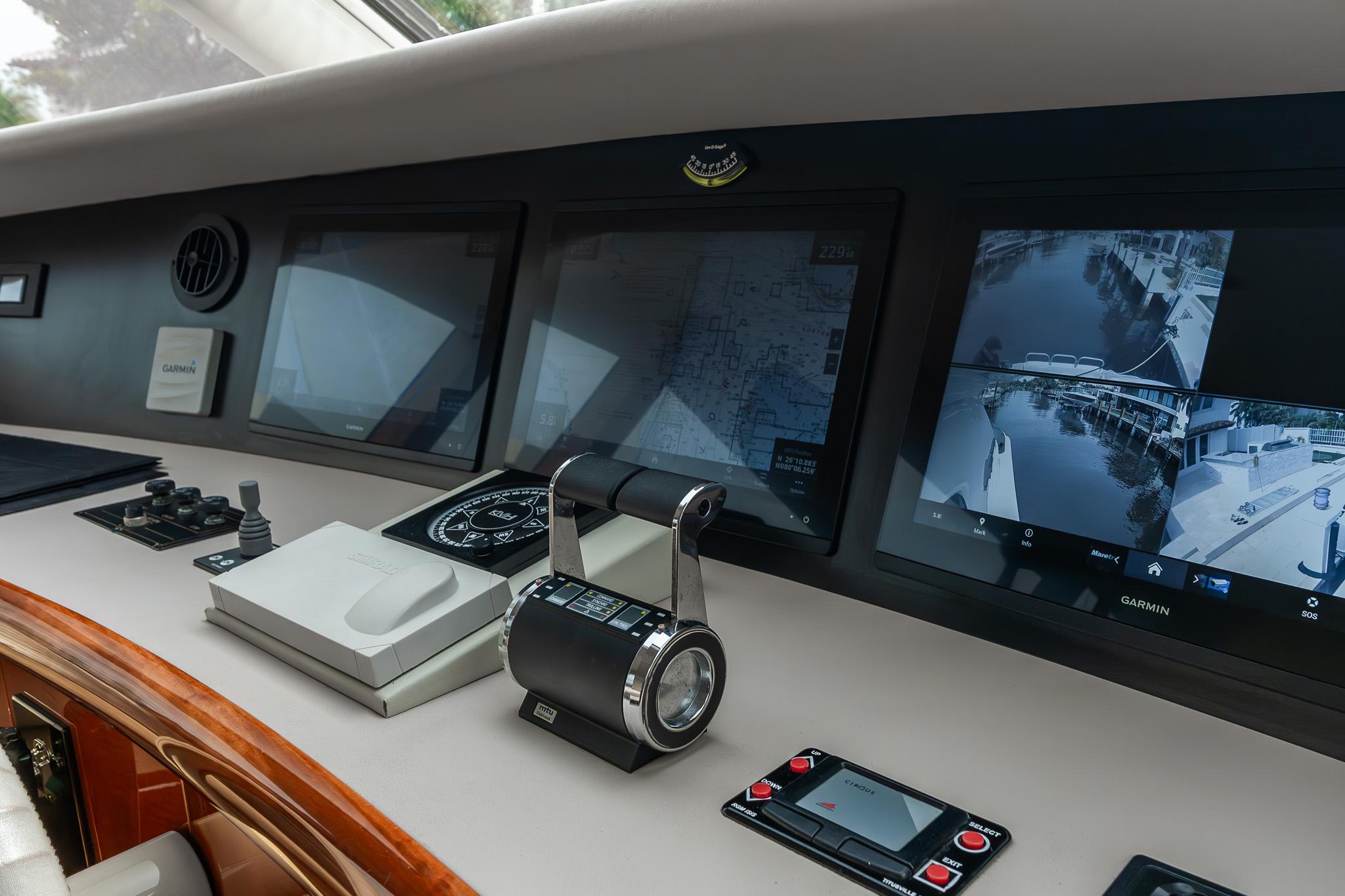 Lazzara-80 Skylounge 2002-Fomo2 FL-US-Control panel of 2002 Lazzara 80 Skylounge yacht with navigation screens and controls.-9749638 | Thumbnail