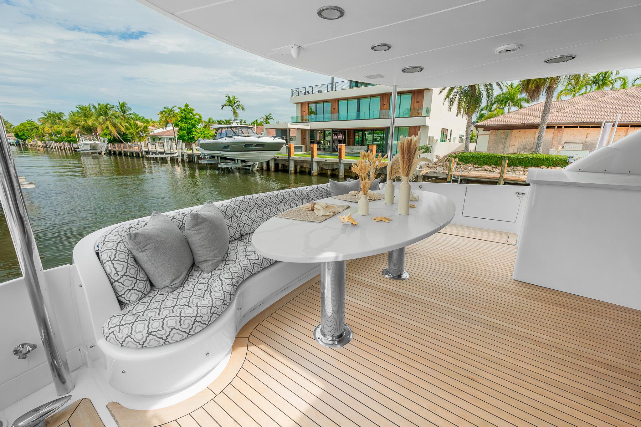 Lazzara-80 Skylounge 2002-Fomo2 FL-US-Luxurious 2002 Lazzara 80 Skylounge yacht deck with elegant seating and waterfront view.-9749638 | Thumbnail