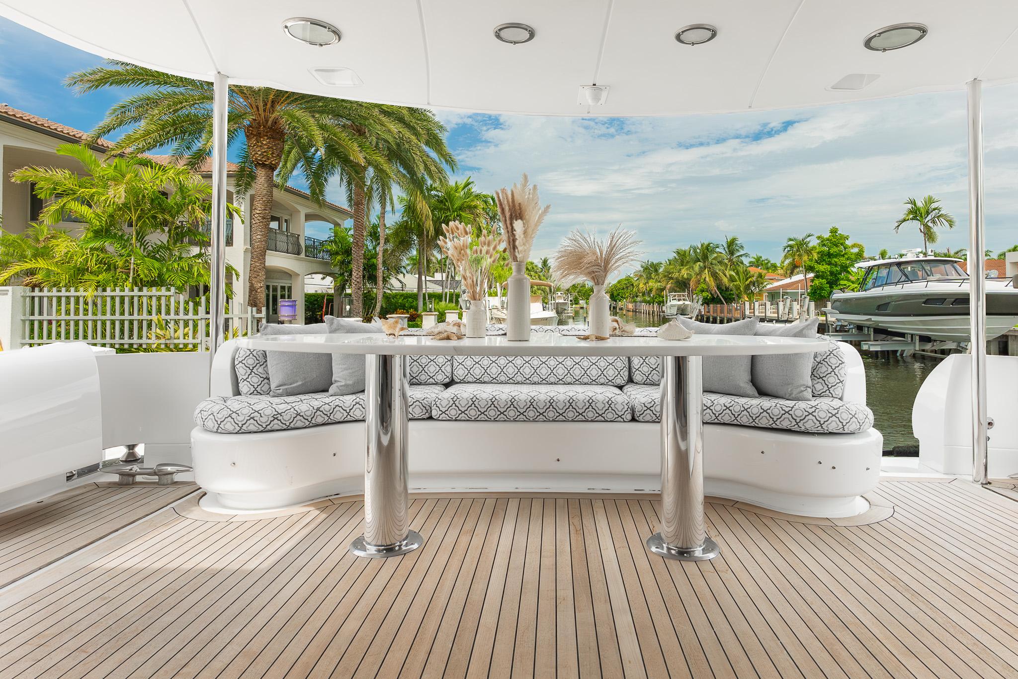 Lazzara-80 Skylounge 2002-Fomo2 FL-US-Luxurious 2002 Lazzara 80 Skylounge yacht deck with elegant seating and scenic waterfront view.-9749638 | Thumbnail