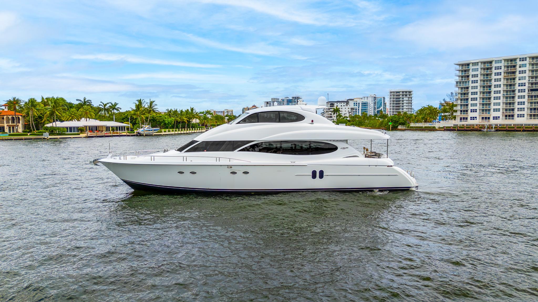 Lazzara-80 Skylounge 2002-Fomo2 FL-US-2002 Lazzara 80 Skylounge yacht cruising on a scenic waterway.-9749638 | Thumbnail