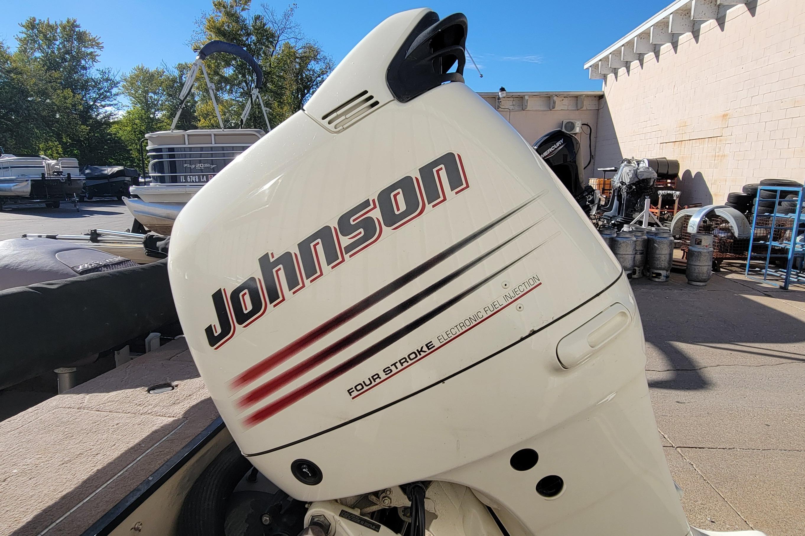 2007 Triton DV 176 Mag with Johnson four-stroke outboard motor in a boatyard.