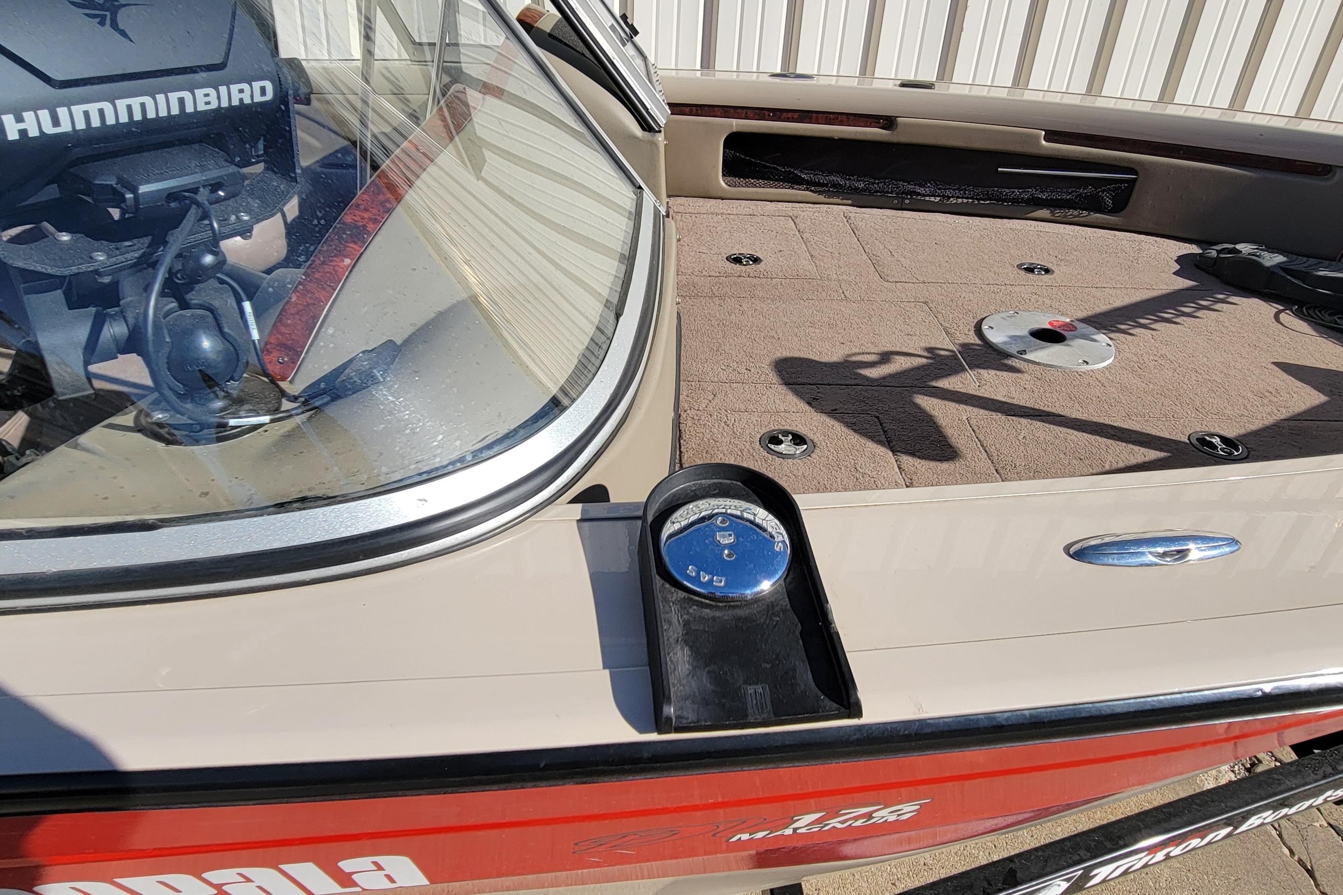 2007 Triton DV 176 Mag boat deck with Humminbird equipment and storage compartments.