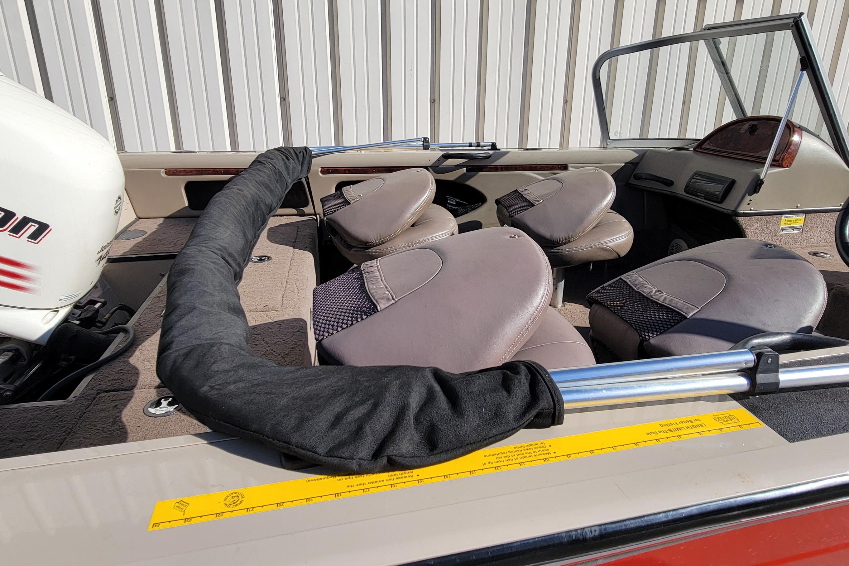 2007 Triton DV 176 Mag boat interior with seating and motor detail.