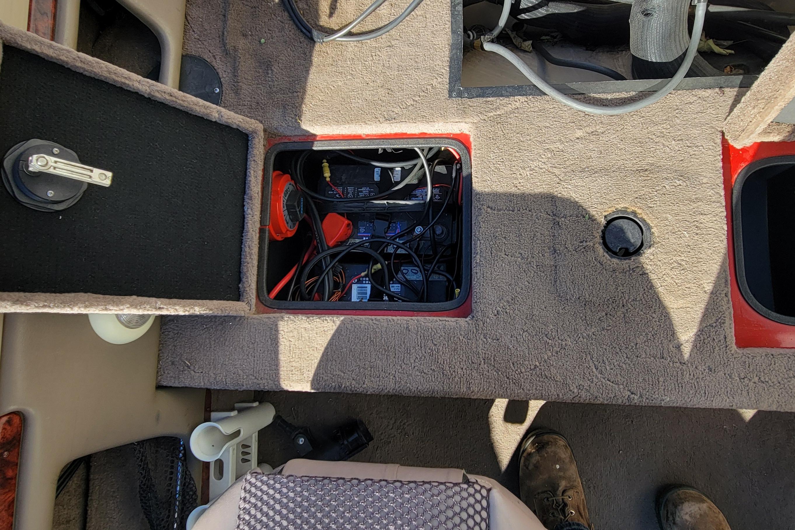 2007 Triton DV 176 Mag boat interior showing battery compartment and wiring.