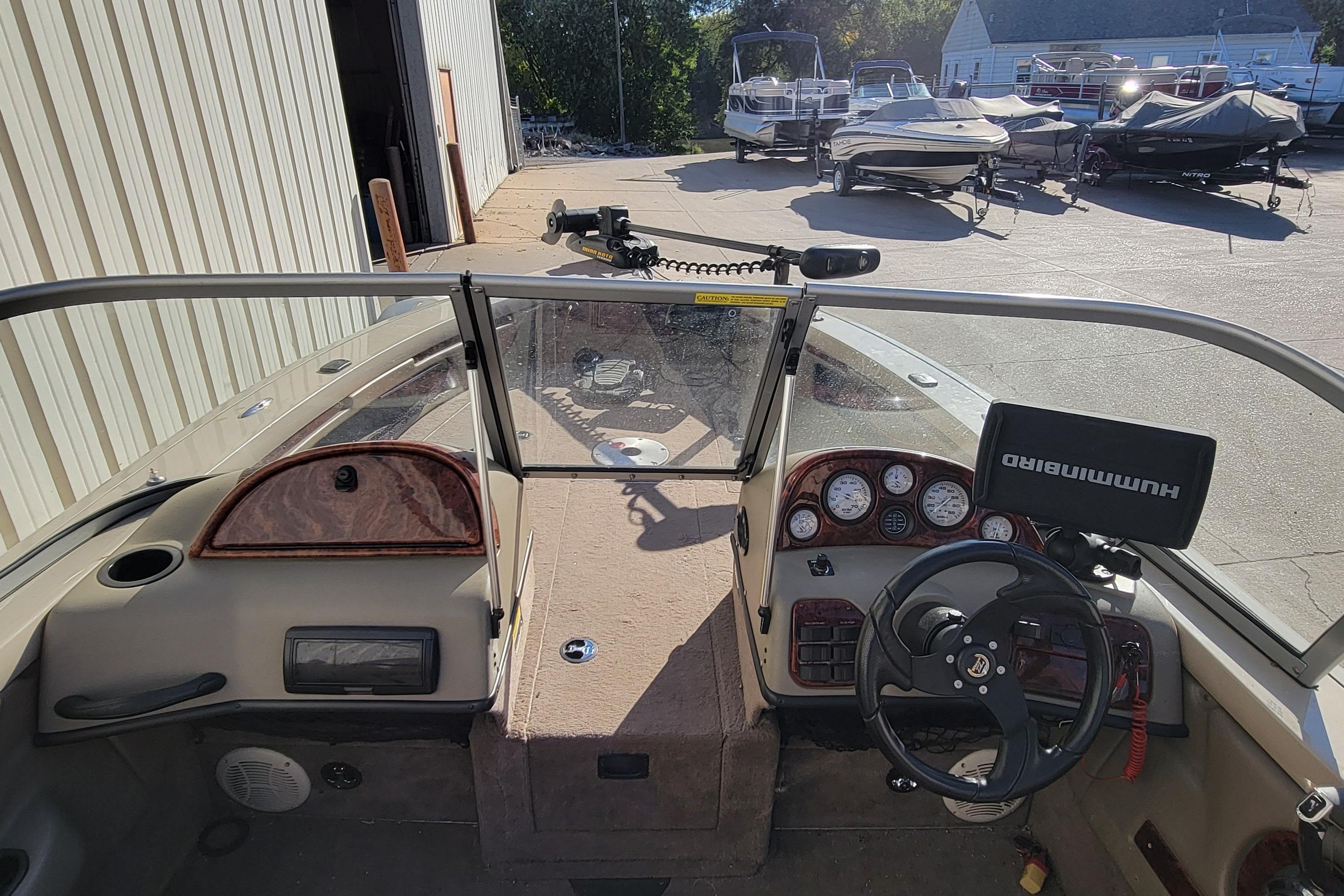 2007 Triton DV 176 Mag boat interior with steering wheel and control panel.