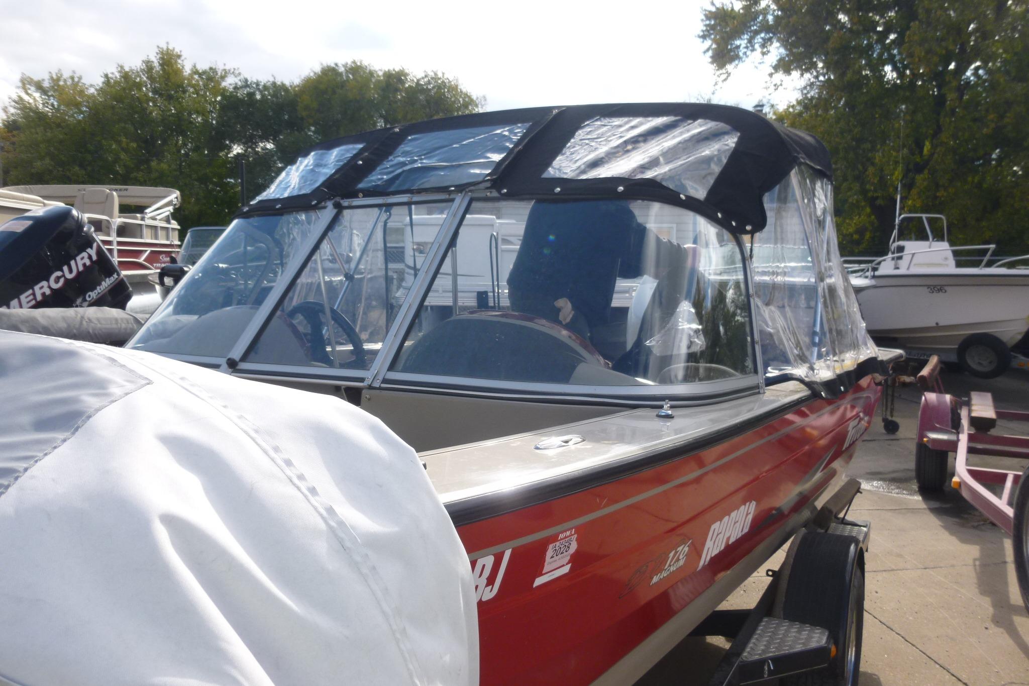 2007 Triton DV 176 Mag boat with canopy, parked on a trailer.