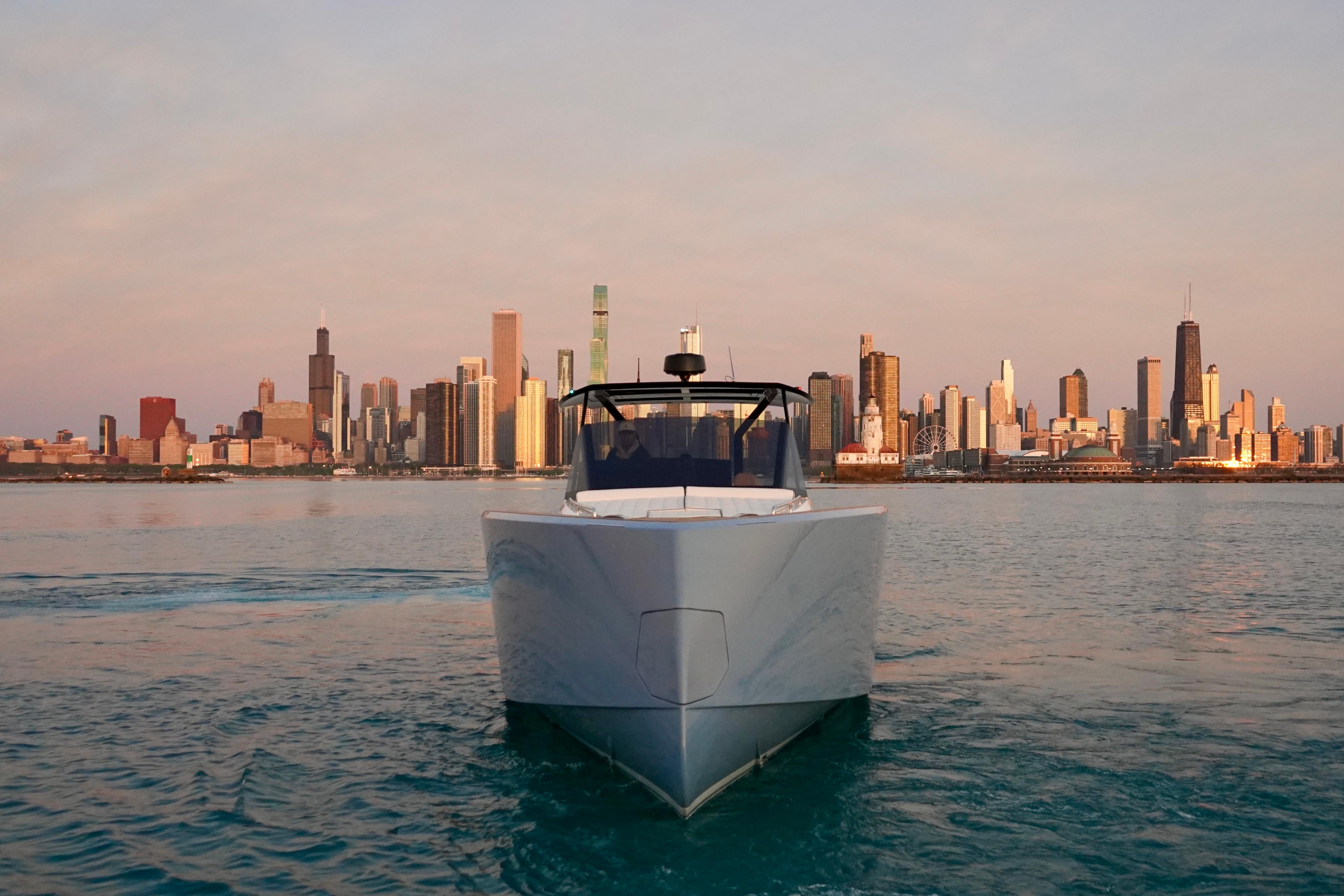 Pardo Yachts-P43 2025 -IL-US-2025 Pardo Yachts P43 cruising with city skyline backdrop at sunset.-9449640