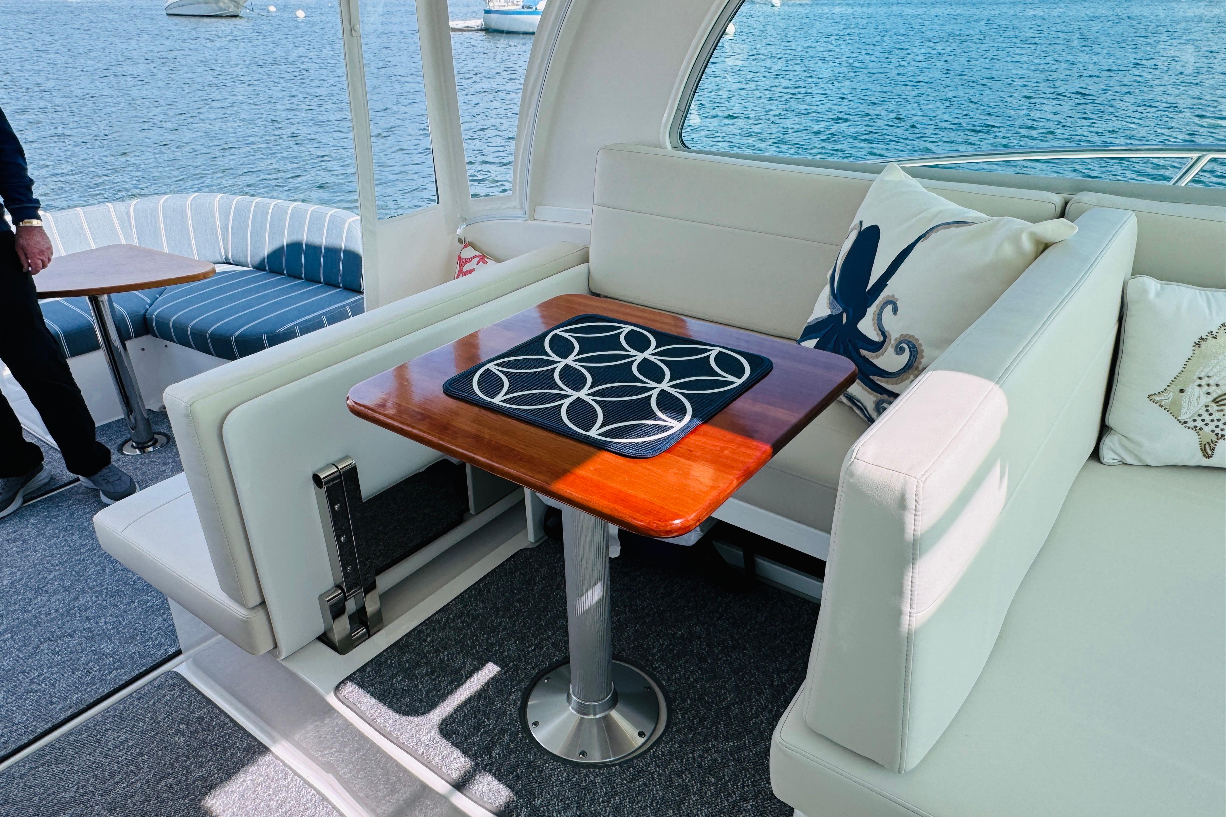 Luxurious interior of 2025 Back Cove 34O yacht with elegant seating and nautical decor.