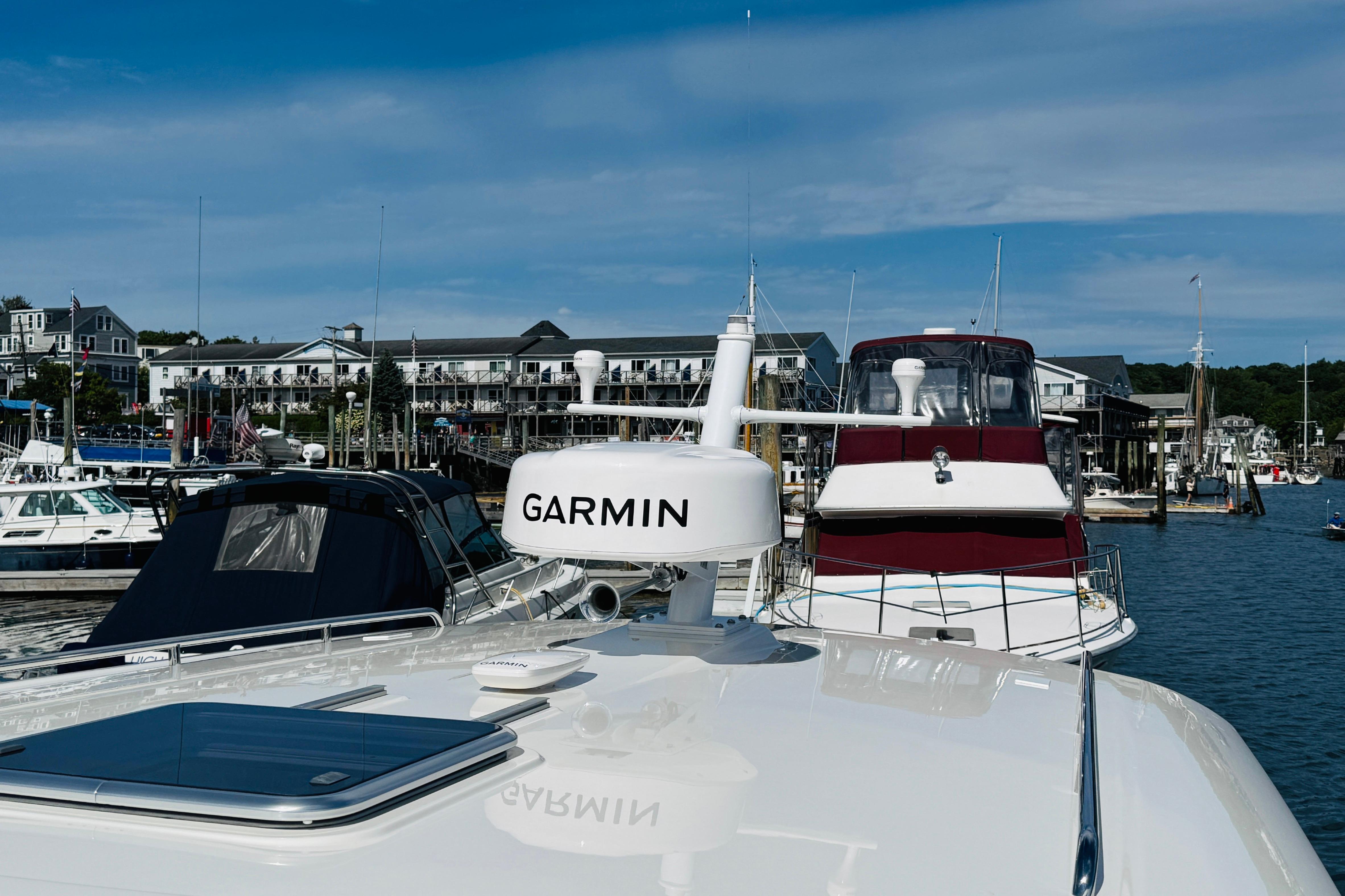 2025 Back Cove 34O yacht with Garmin equipment docked at a marina.