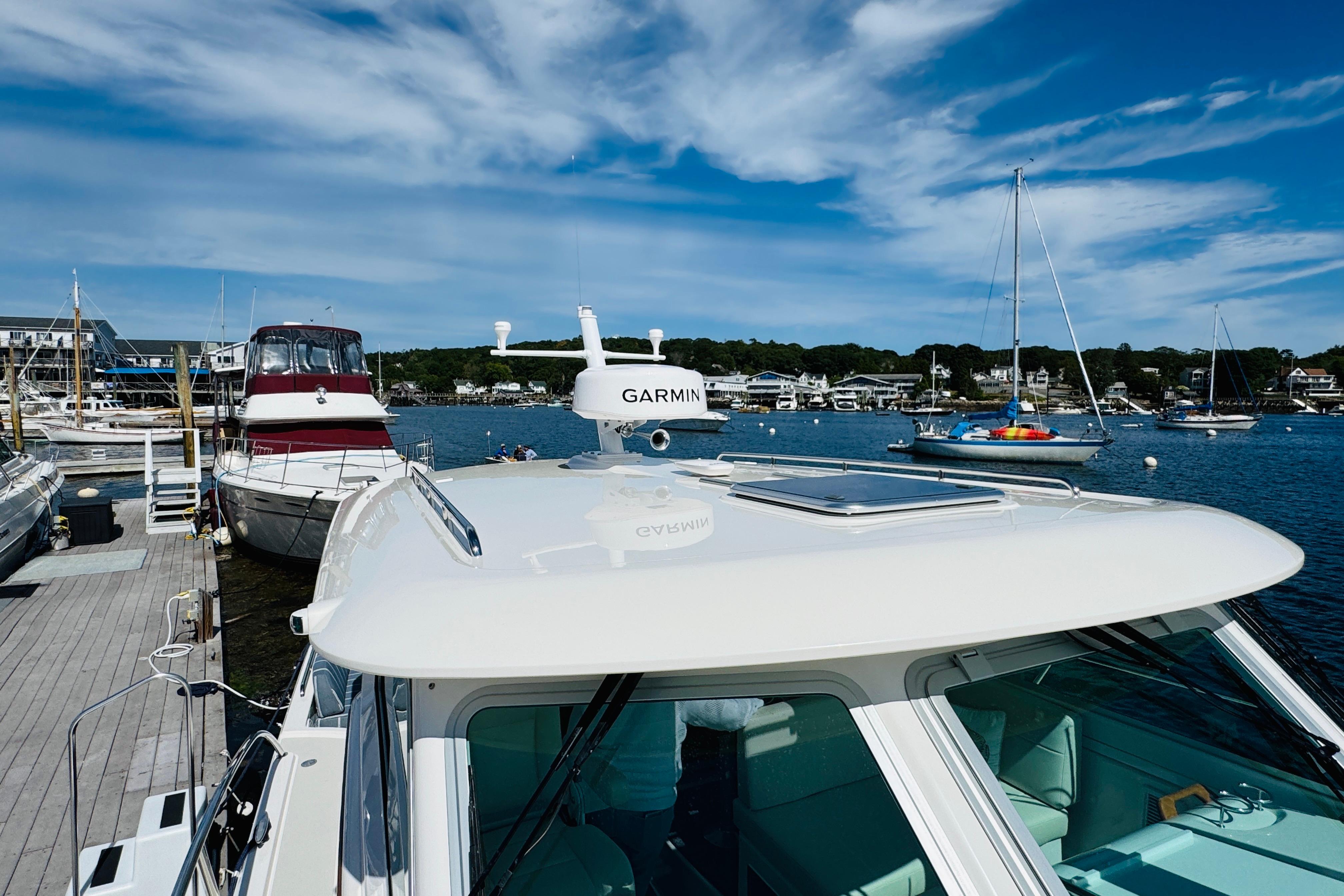 2025 Back Cove 34O docked at marina with clear blue sky.