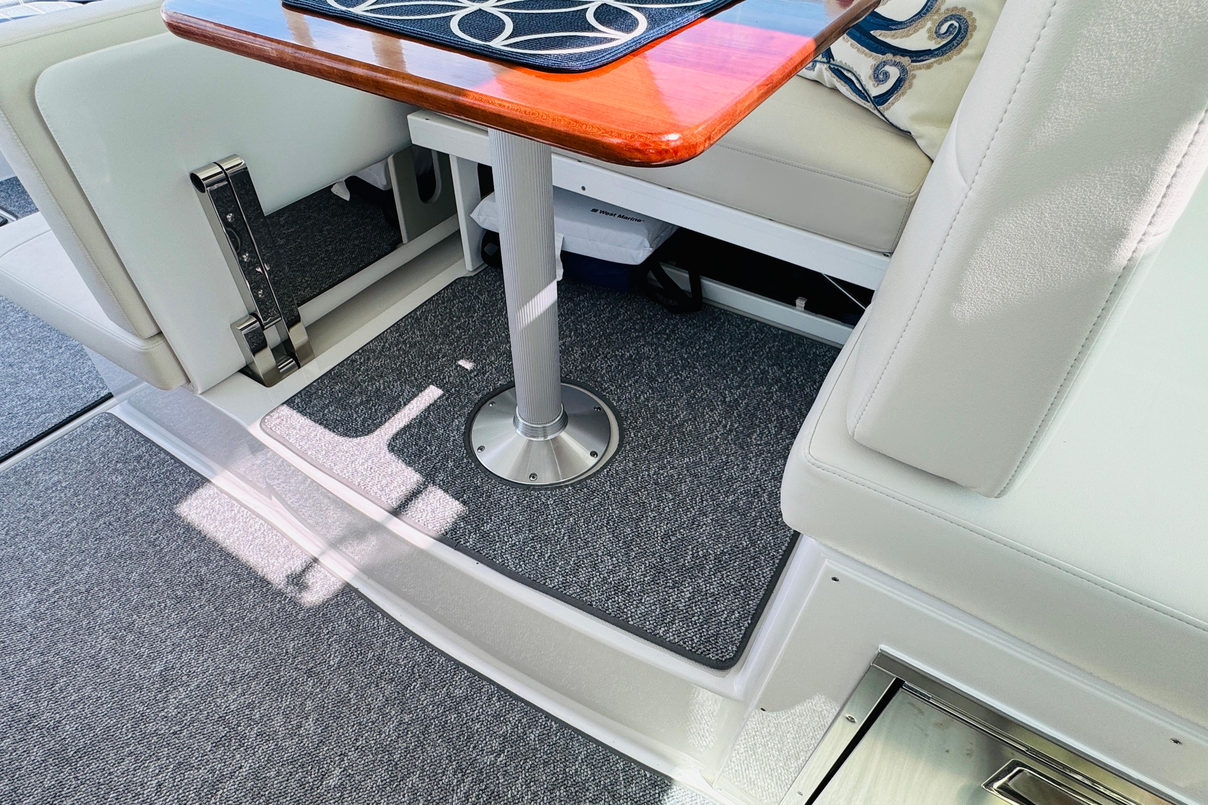 Interior of 2025 Back Cove 34O boat with elegant seating and table design.