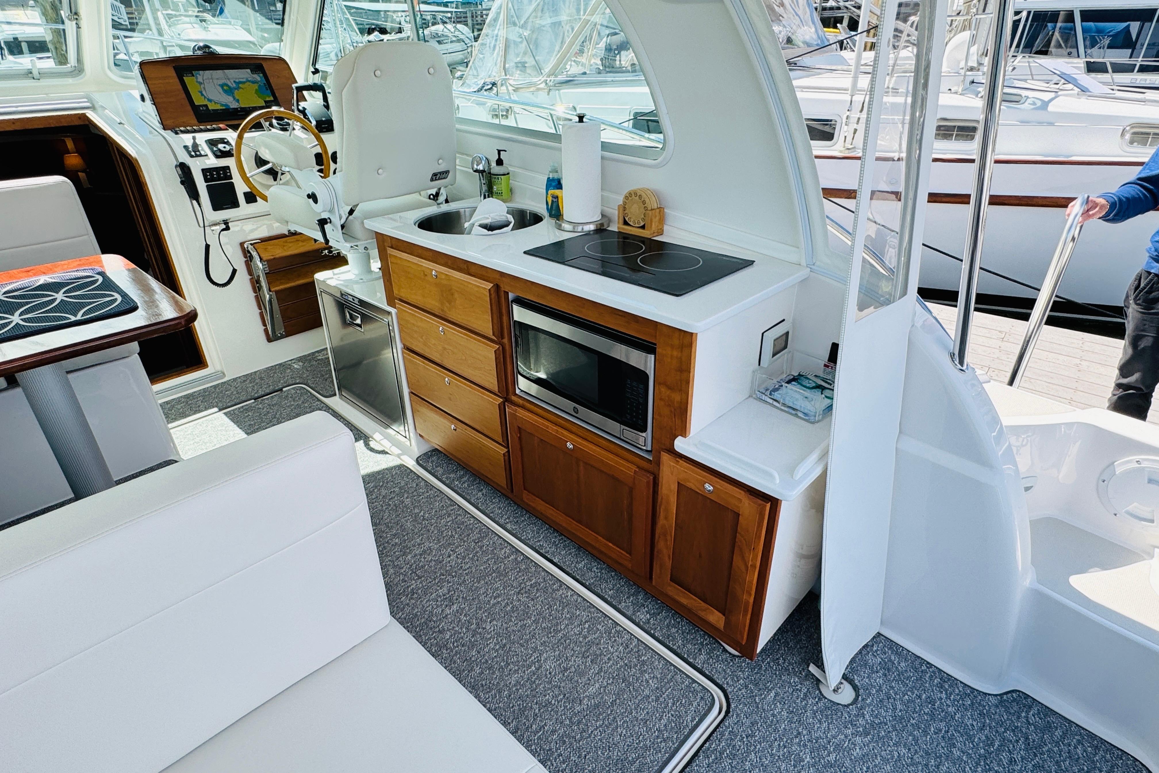 Interior of 2025 Back Cove 34O yacht with modern kitchen and navigation area.