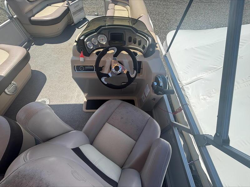 2015 Sun Tracker PARTY BARGE® 22 DLX interior with steering console and seating.