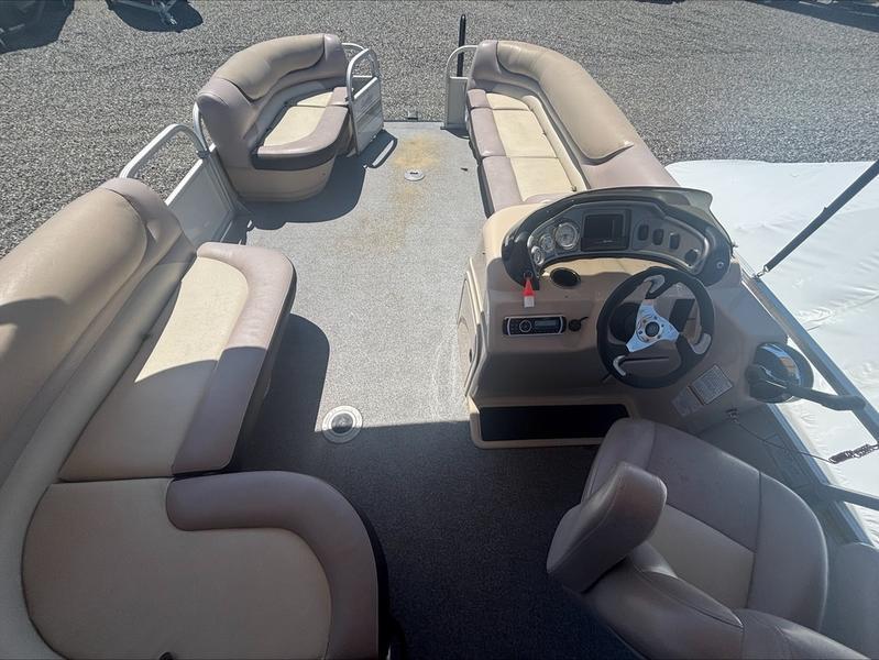 2015 Sun Tracker PARTY BARGE® 22 DLX interior with spacious seating and steering console.