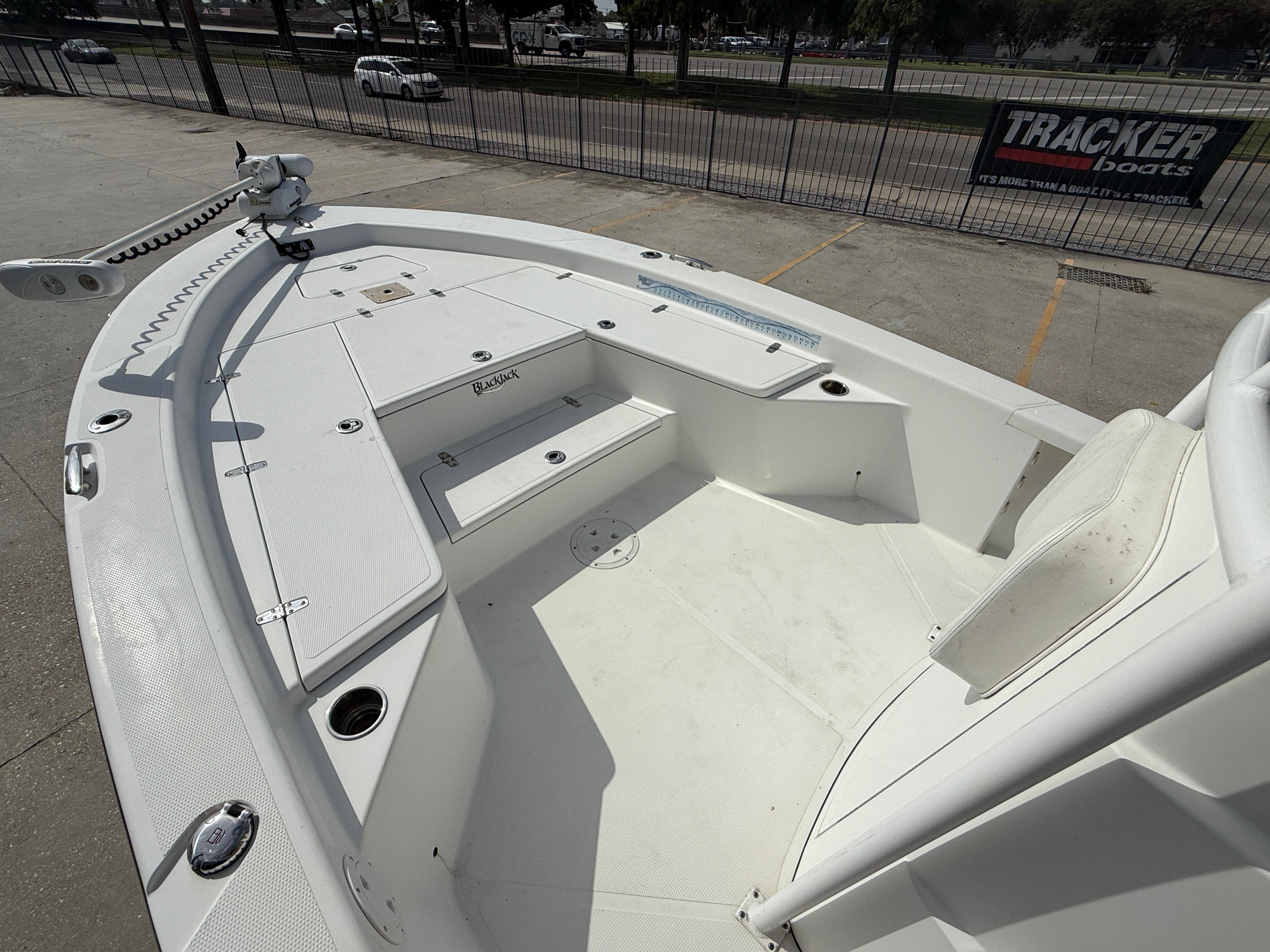 2018 BlackJack 256 boat deck with seating and storage compartments.