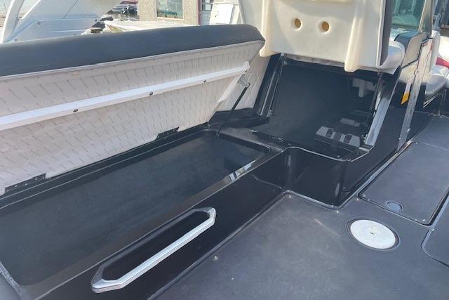 2013 MasterCraft X-25 boat interior storage compartment with open seating and sleek design.